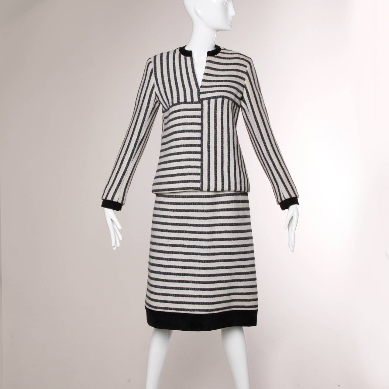 Reduced from $650. Gorgeous 1960s B.H. Wragge skirt suit in geometric striped woven wool. This ensemble features a top and skirt that can be worn together or separate. Couture hand stitched detailing and fully lined in silk. 

Details:

Fully