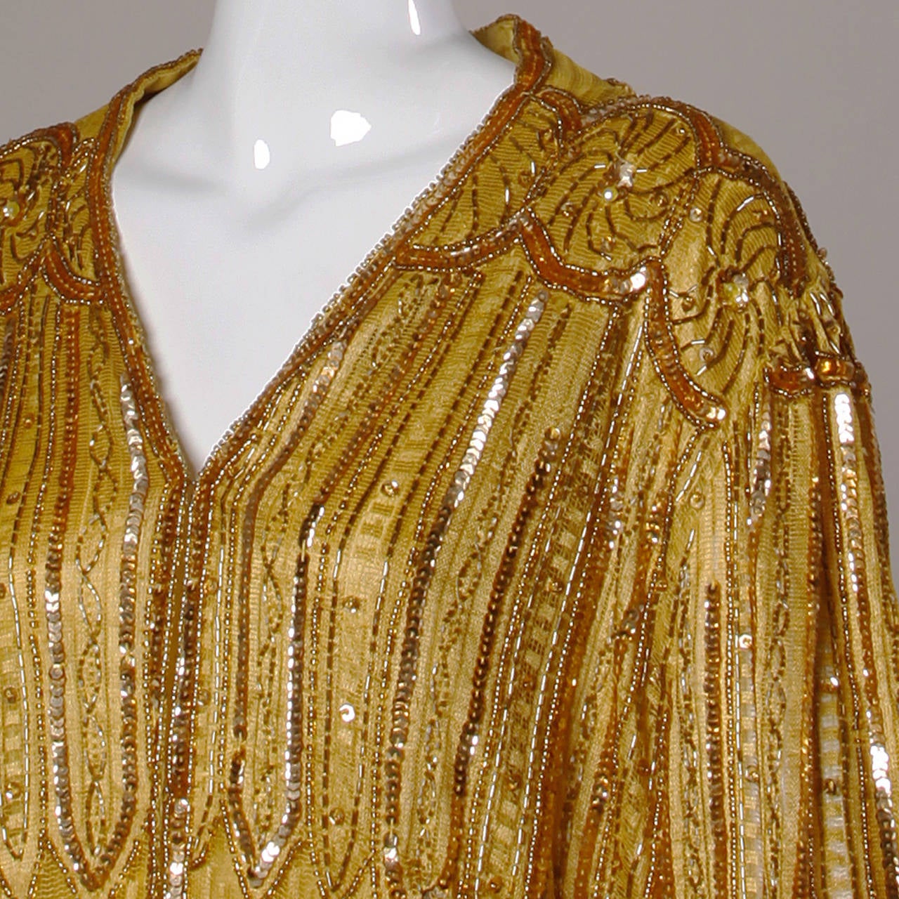 Vintage 1920s-inspired 1980s gold sequin duster with Art Deco design and 