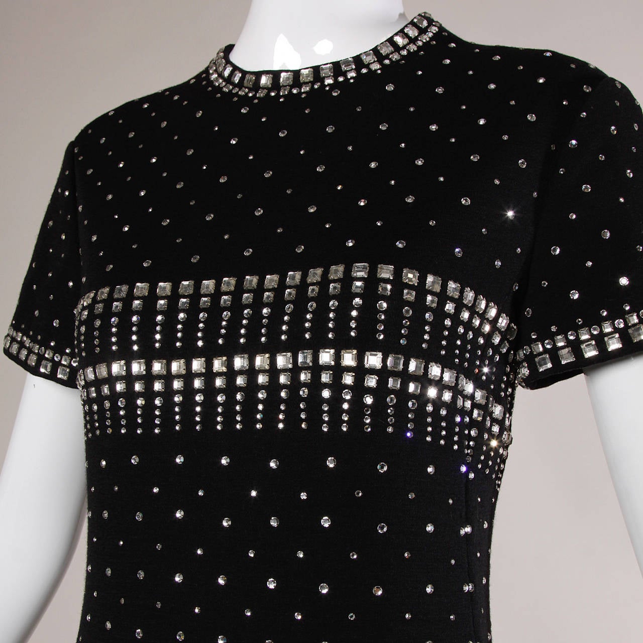 Absolutely stunning vintage Geoffrey Beene black wool knit maxi dress completely encrusted in tiny prong set sparkling rhinestones. This dress is just unbelievable in person and extremely heavy from all the embellishment. Gorgeous construction with