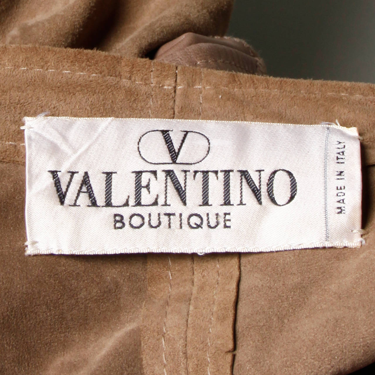 Beautifully made delicate buttery suede leather bomber jacket with smooth leather detailing by Valentino Boutique. Snap closure and rare label. We are offering the matching culottes in another listing!

Details:

Unlined 
Front