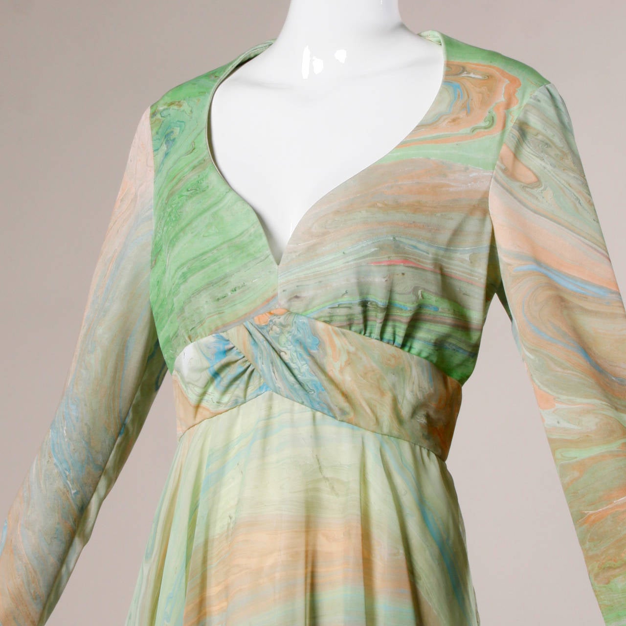Vintage 1970s marbleized print maxi dress in earth tone shades of green, blue and sand by Don Luis for Bonwit Teller.

Details:

Fully Lined
Back Zip and Hook Closure
Marked Size: 14
Estimated Size: M-L
Color: Marbleized Swirl
Fabric: Not