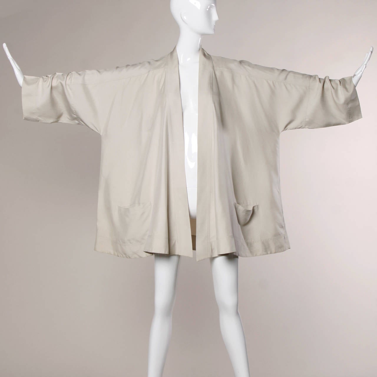 Stunning vintage Salvatore Ferragamo silk swing coat or kimono jacket. Oversized fit and huge sweep.

Details:

Unlined
Front Pockets
No Closure
Marked Size: 42
Estimated Size: Free
Color: Neutral
Fabric: 100% Silk
Label: Salvatore