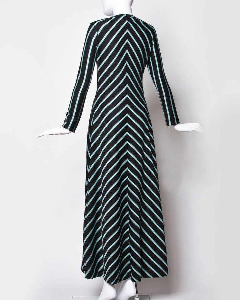 Long sleeved jersey knit maxi dress by Mam'selle with blue chevron stripes. Simple and chic!

Measurements

Bust: Up to 18