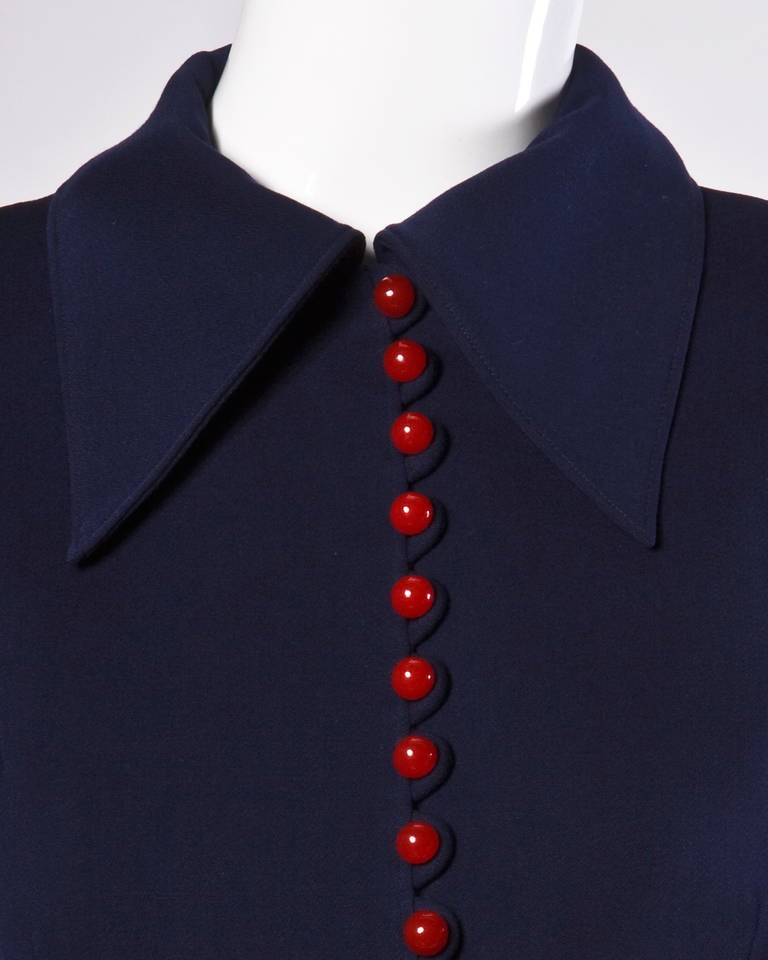Fantastic 1940s tailored navy wool jacket with red bobble buttons.

Details:

Fully Lined
Shoulder Pads Sewn into Lining
Closure: Front Button Closure
Estimated Size: M-L
Color: Navy/Red

Measurements:

Bust: Up To 38