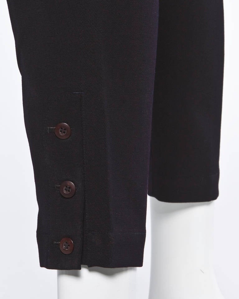 Partially Lined
Side and Back Pockets
Front Metal Zip and Button Closure/ Pant Leg Button Closure
Marked Size: 6
Color: Dark Navy
Fabric: 100% Wool
Label: Issey Miyake
Estimated Size: XS-S

Measurements:

Waist: 24