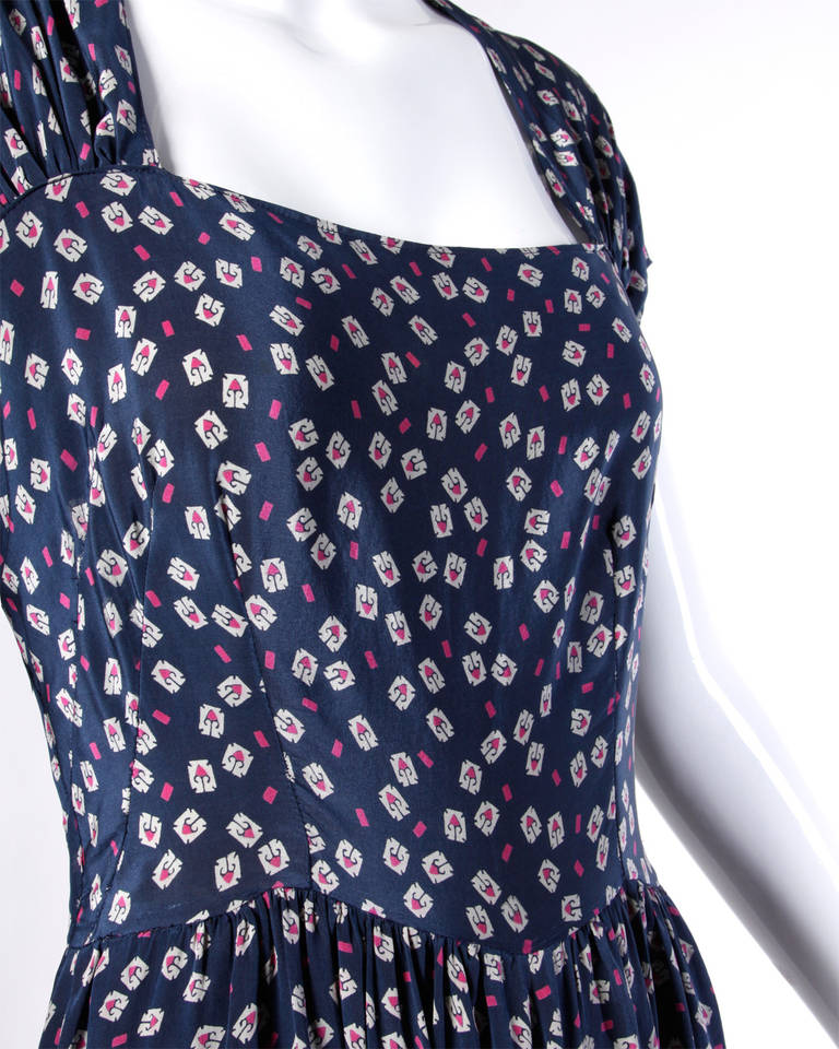 Darling vintage screen printed floral silk dress from the late 1930s/ early 1940s.

Details:

Unlined
Side Metal Zip Closure
Marked Size: Not Marked
Estimated Size: Medium
Color: Navy/ Magenta/ White
Fabric: 100% Silk

Measurements: