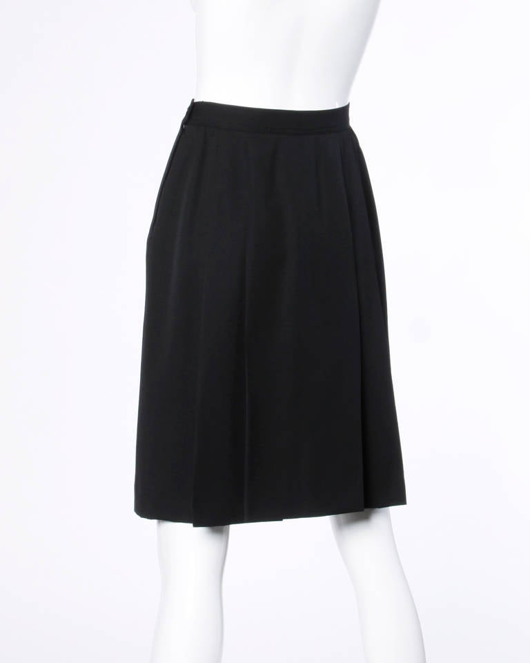 Beautiful and classic black wool skirt by Valentino. Gorgeous construction. Simple and chic.

Details:

Fully Lined
Side Zip Button Closure
Marked Size: 8/42
Color: Black
Fabric: 100% Wool
Label: Valentino

Measurements:

Waist: