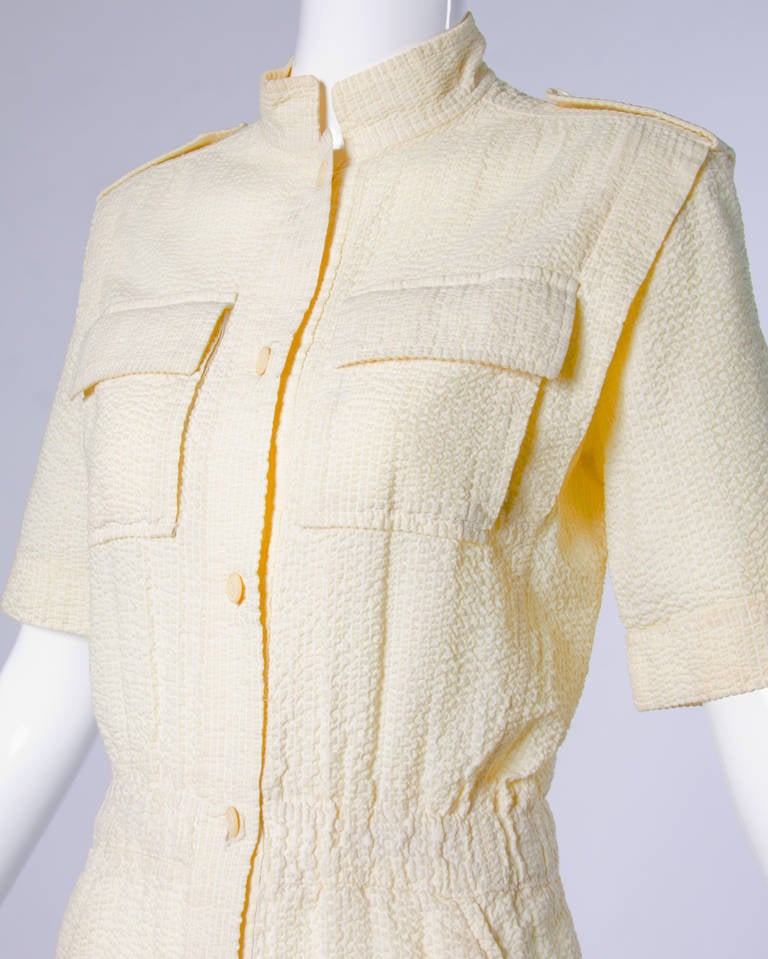 Vintage Ted Lapidus button up yellow seersucker jumpsuit with cropped pants and sleeves.

Details:

Side Pockets
Front Button Closure
Color: Yellow
Fabric: Feels like Cotton
Label: Ted Lapidus/ Boutique Haute Couture
