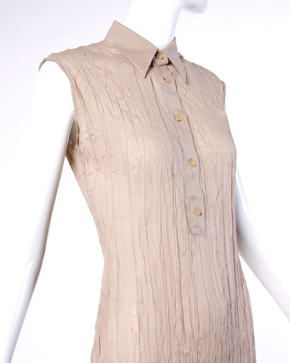 Vintage 1990s neutral sheer wrinkle texture maxi dress with a pointed shirt collar and button up front.

Details:

Unlined
Front Button Closure
Marked Size: 4/ 38
Color: Taupe
Label: Gianfranco Ferre

Measurements:

Bust: Up to