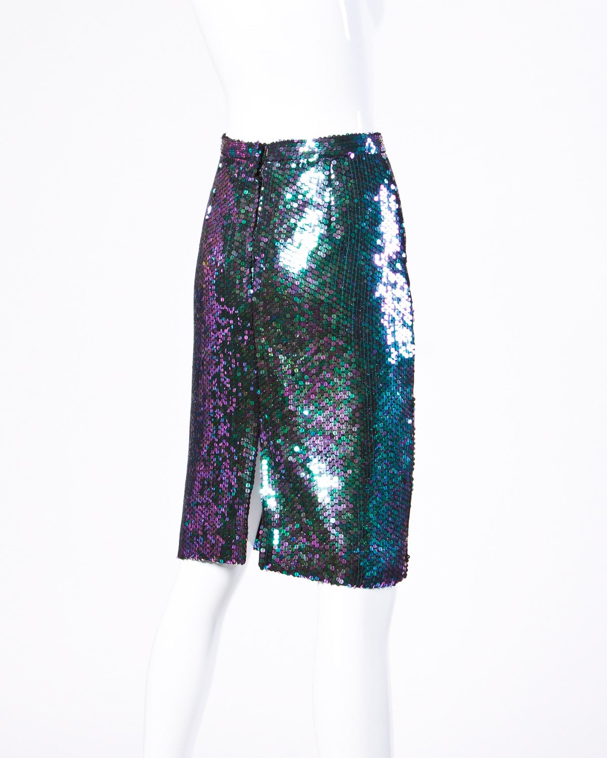 Vintage 1985 iridescent green sequin skirt by Jeanette for St. Martin.

Details:

Fully Lined
Back Zip and Hook Closure
Marked Size: 10
Estimated Size: Medium
Color: Black/ Green/ Purple
Label: Jeanette for St.