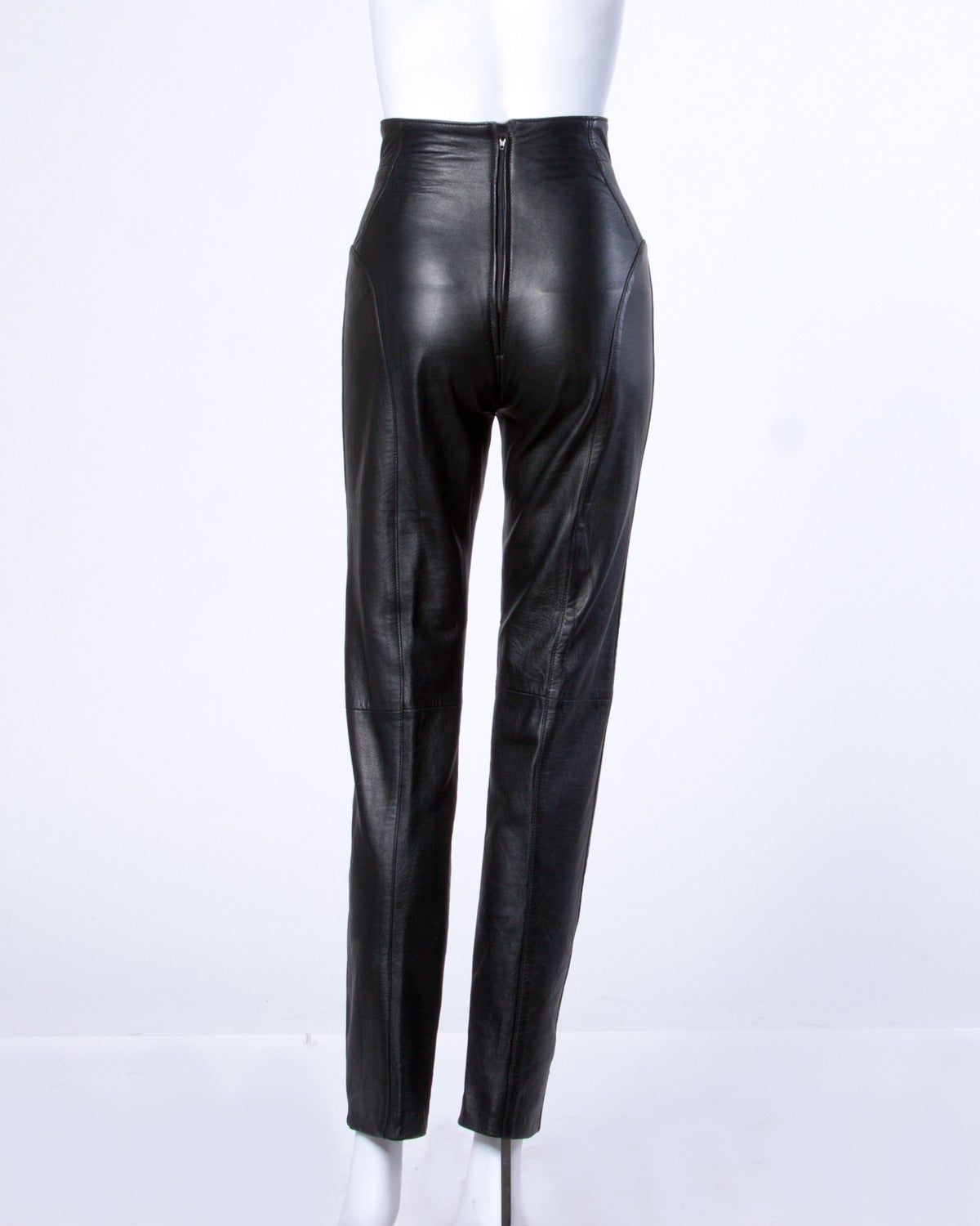 Soft buttery leather high waisted vintage pants by Michael Hoban for North Beach Leather.

Details:

Fully Lined
Back Zip Closure
Marked Size: 3/4
Estimated Size: XS
Color: Black
Fabric: Leather
Label: Michael Hoban for North Beach