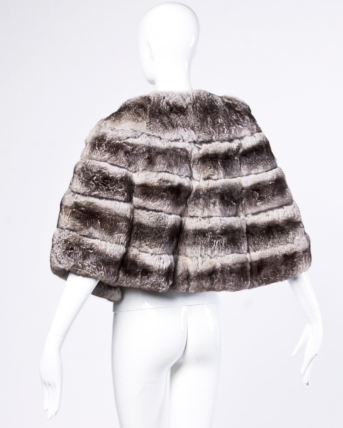 Absolutely stunning quality chinchilla fur stole, cape or wrap. Creamy soft and plush chinchilla fur is in perfect vintage condition. A rare find!

Details:

Fully Lined
Front Hook Closure
Estimated Size: Small-Large
Color: Gray/