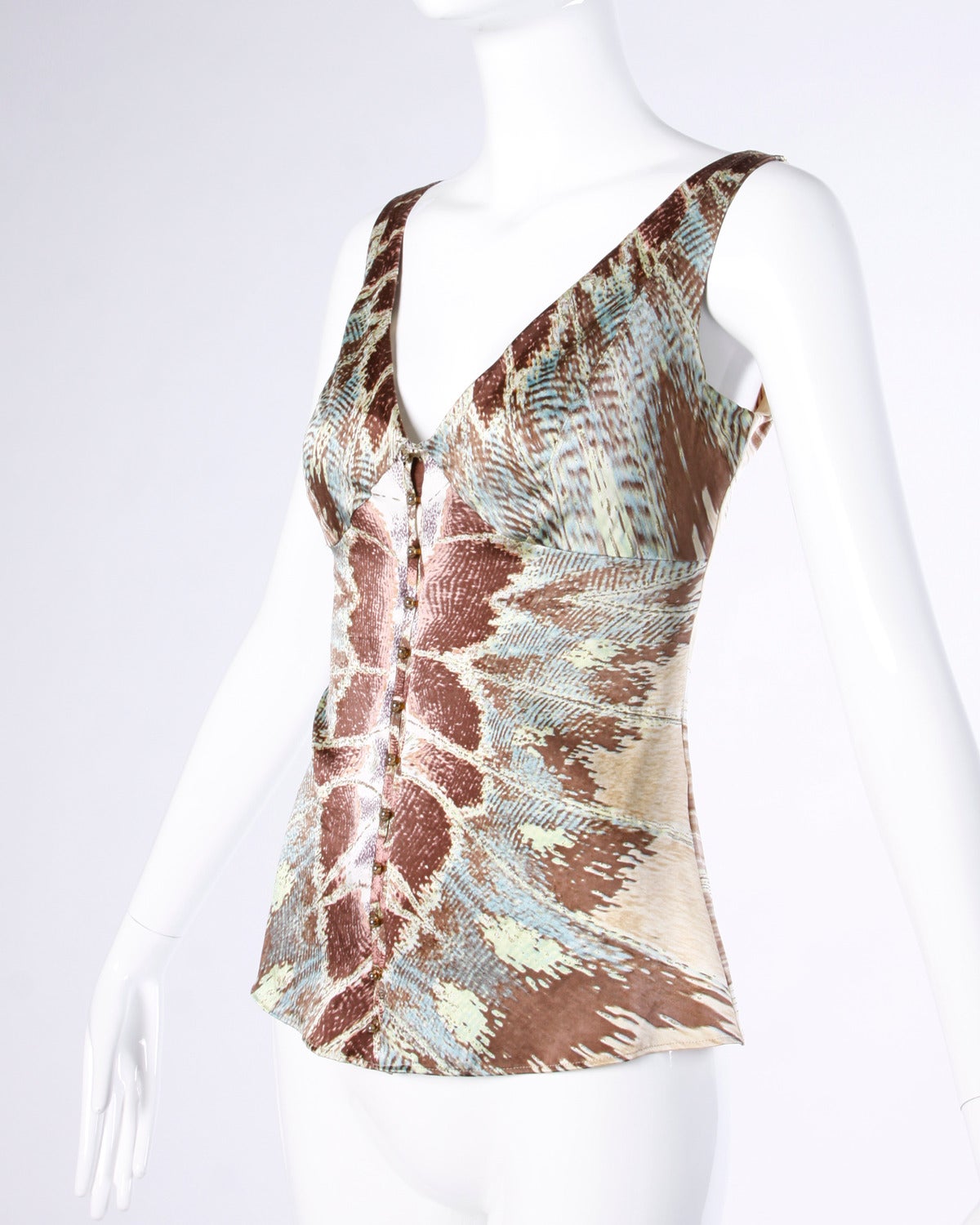 Gorgeous Roberto Cavalli silk tank top with a mirror snake print on the front and a diagonal striped print on the back.

Details:

Partially Lined
Front Hook Closure
Marked Size: Large
Color: Gold/ Brown/ Blue/ Green
Fabric: Silk