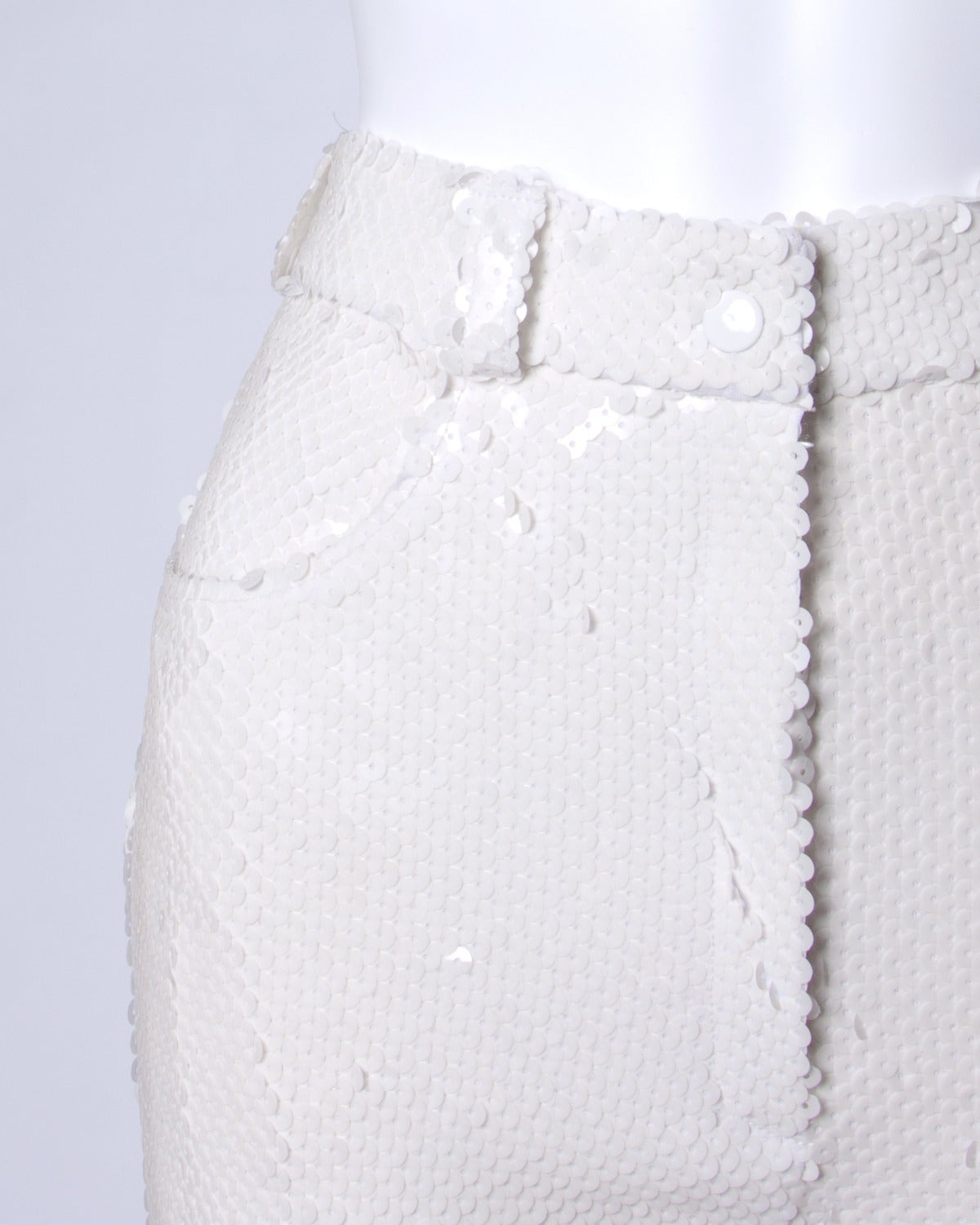 Jaw dropping vintage white sequin pants by Jeanette for St. Martin.

Details:

Fully Lined
Back Pockets
Front Pockets
Front Zip and Snap Closure
Marked Size: 10
Estimated Size: Medium
Color: White
Fabric: Sequins
Label: Jeanette for ST.