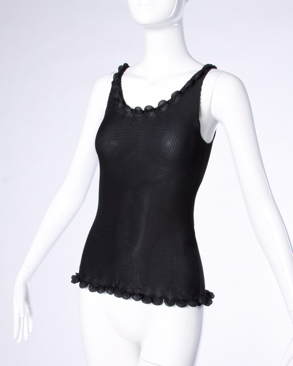 Me by Issey Miyake sculptural black silk tank top with pleats.

Details:

Unlined
No Closure
Marked Size: Not Marked
Estimated Size: S-M
Color: Black
Fabric: Feels like Silk
Label: Me by Issey Miyake

Measurements:

Bust: 28