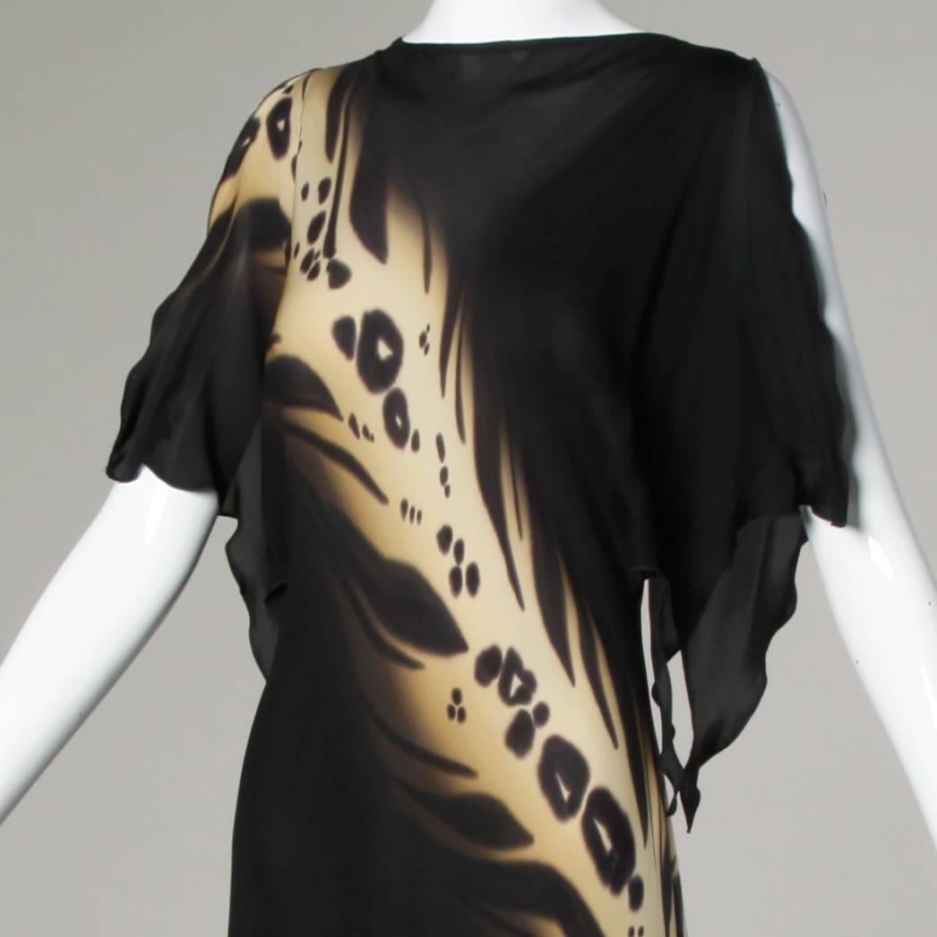 Flattering vintage hand painted silk gown with an asymmetric leopard design and high low hem. 

Details:

Unlined
Marked Size: L
Estimated Size: M-L
Color: Rose/ Purple/ Multicolor/ Brown/ Blue/ Etc
Fabric: Silk
Label: Yolanda Lorente