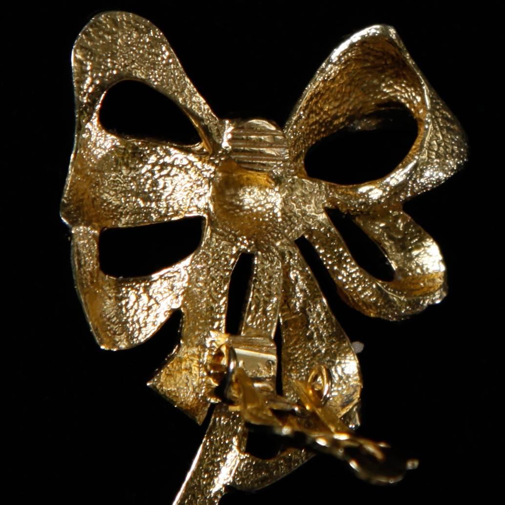 Givenchy gold plated bow earrings with clip backs. Signature on the back of the clip. Large 1.25