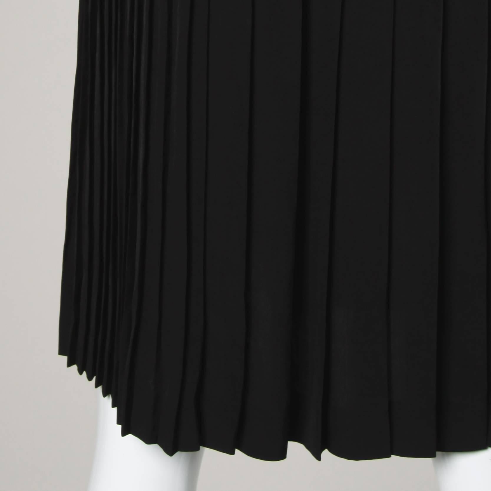 Simple and chic black Prada skirt with back pleating.

Details:

Unlined
Closure: Side Zip and Hook Closure
Marked Size: 38
Estimated Size: Small-Medium
Color: Black
Fabric: 100% Triacetate 
Label: Prada

Measurements:

Waist: