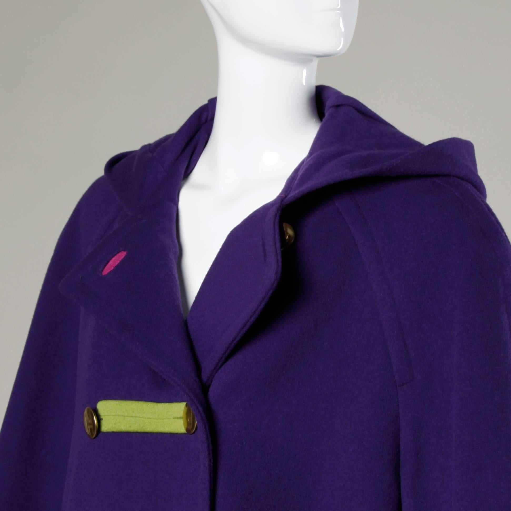 Vibrant purple color block swing coat with a hood by Bill Blass for Neiman Marcus.

Details:

Fully Lined
Front Pockets
Shoulder Pads Sewn Into Lining
Front Button Closure
Marked Size: Not Marked
Estimated Size: L
Color: Purple/