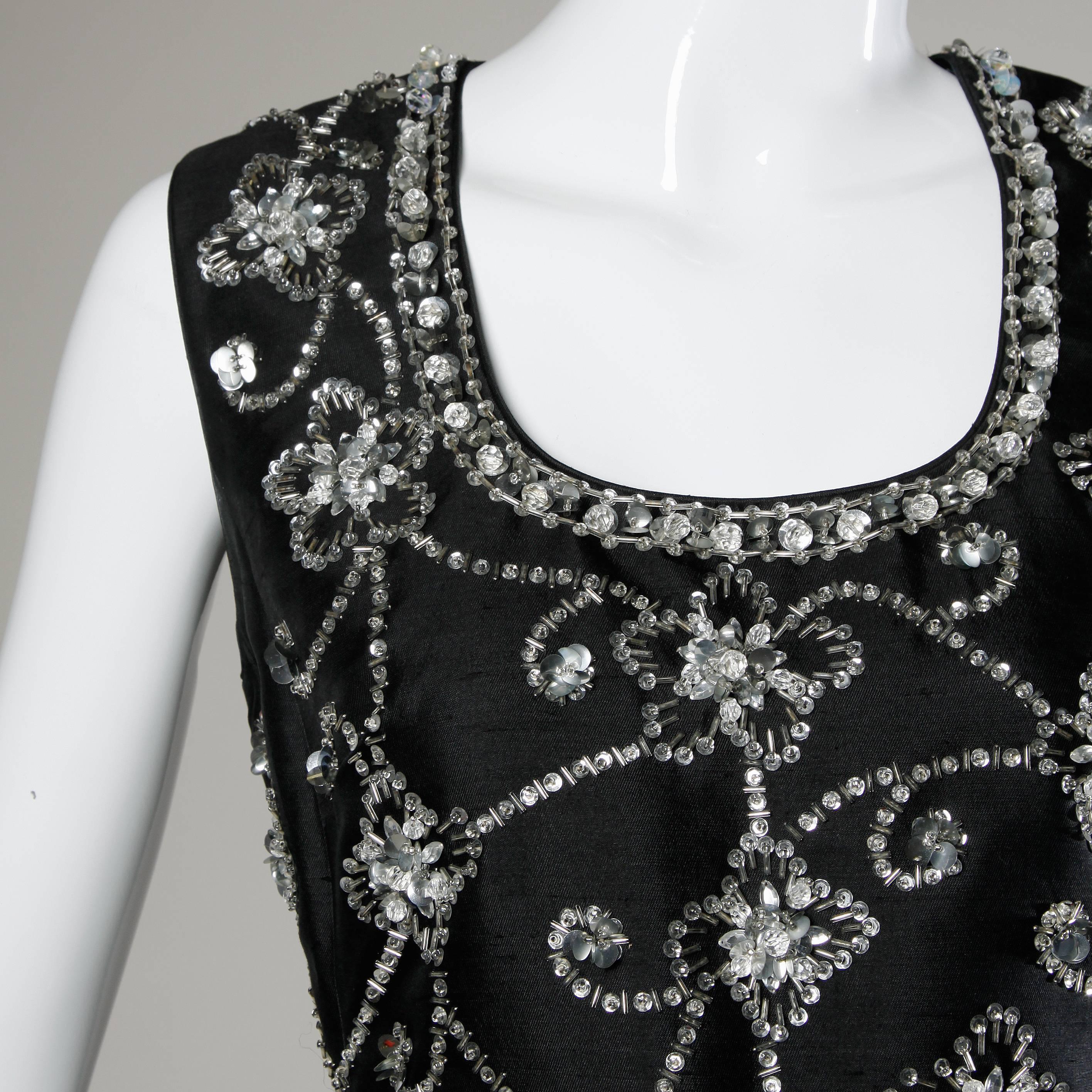 Gorgeous vintage silk and wool maxi dress with rhinestones, beads and sequins. All hand finished! Made in the British Crown Colony of Hong Kong.

Details:

Fully Lined
Back Metal Zip and Hook Closure
Marked Size: US 14
Estimated Size: M
Color:
