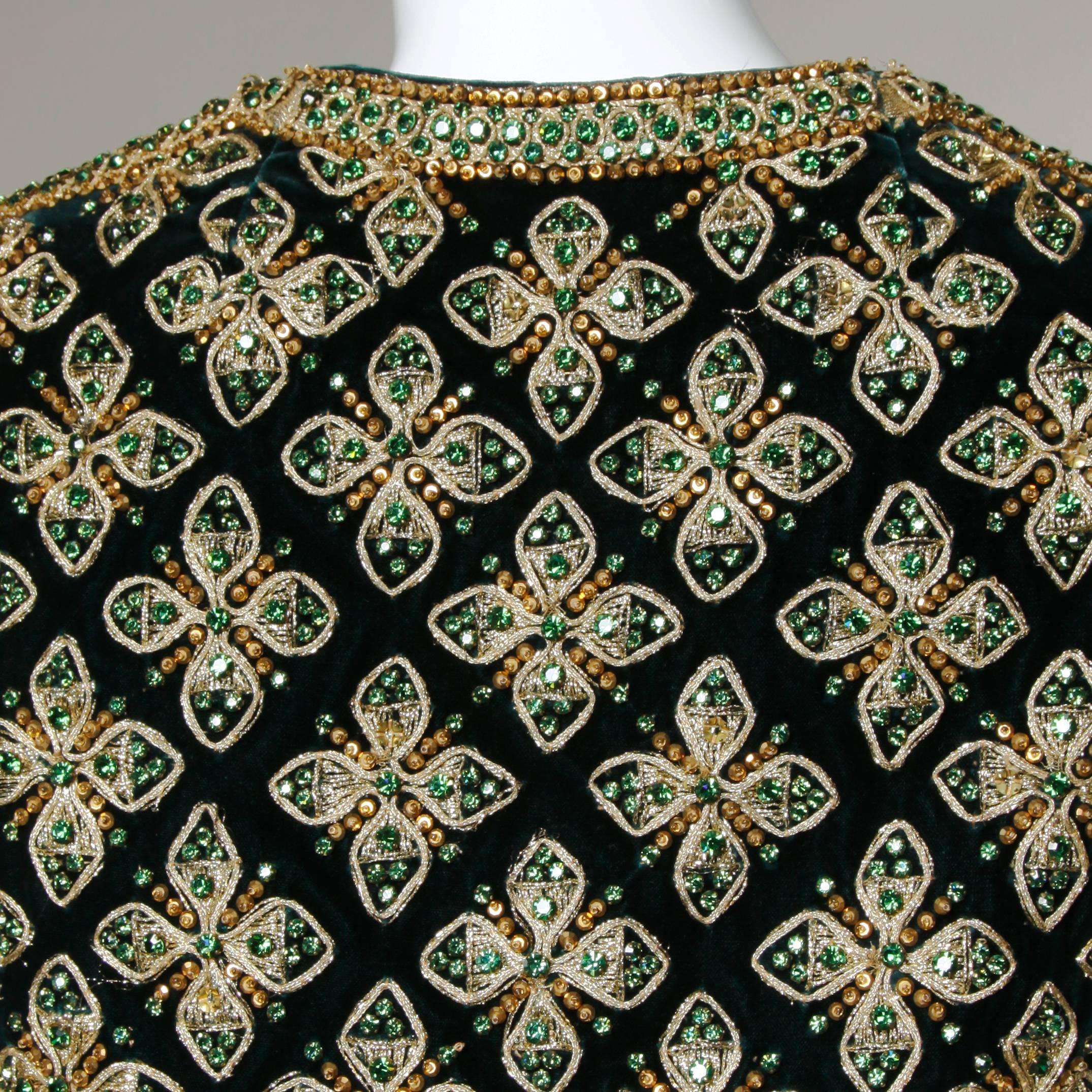 Matador-inspired vintage 1960s rhinestone, sequin and beaded vest by Marie McCarthy for Larry Aldrich. Beautiful detailing and mint condition.

Details:

Fully Lined
No Closure
Marked Size: 10
Estimated Size: S-M
Color: Dark Green/