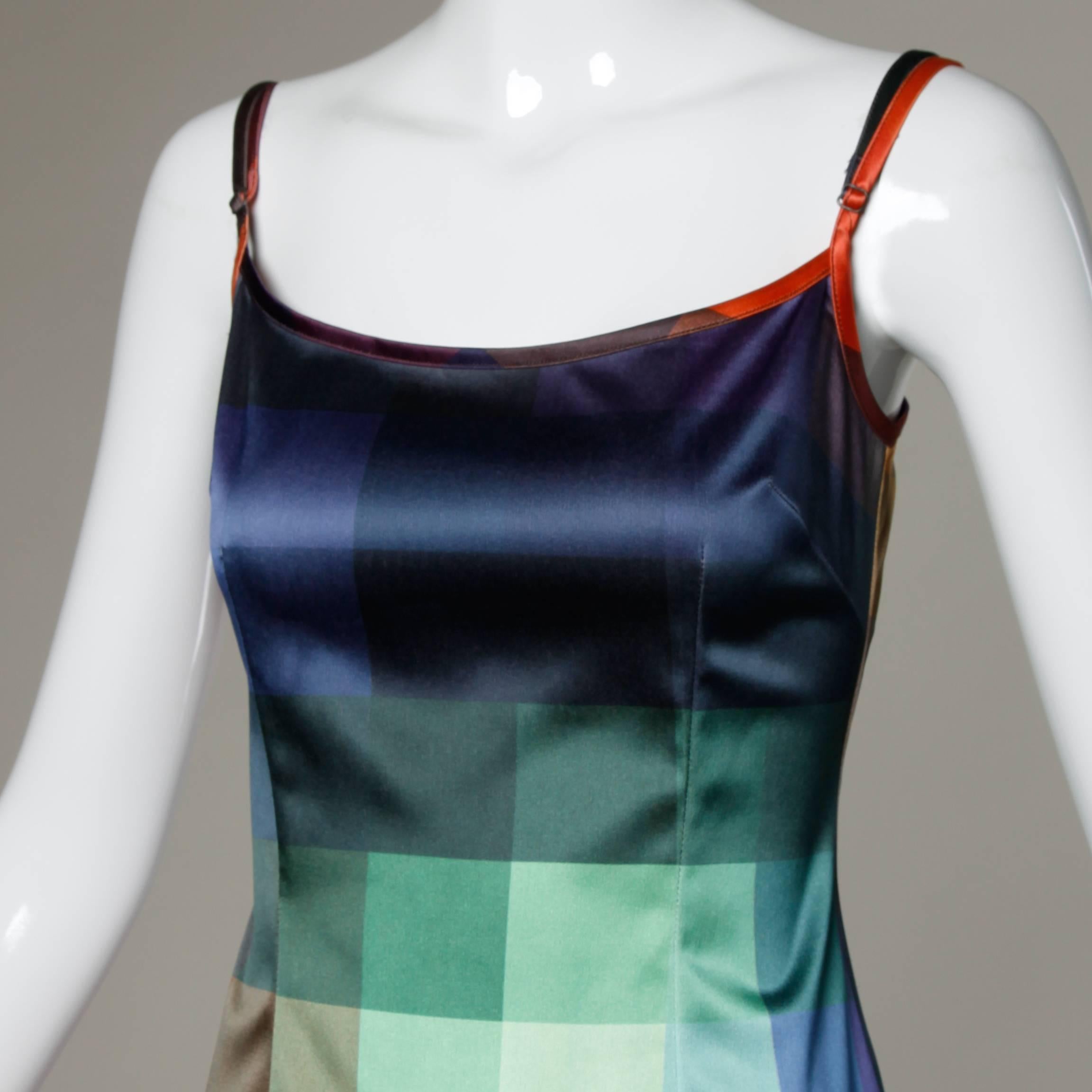 Fantastic vintage dress in checkered rainbow ombre by Moschino Jeans. 

Details:

Unlined
Back Zip and Hook Closure 
Marked Size: I 42/ USA 8/ F 38/ GB 12
Estimated Size: Small
Color: Multicolored 
Fabric: 95% Polyester/ 5% Elastic 
Label: