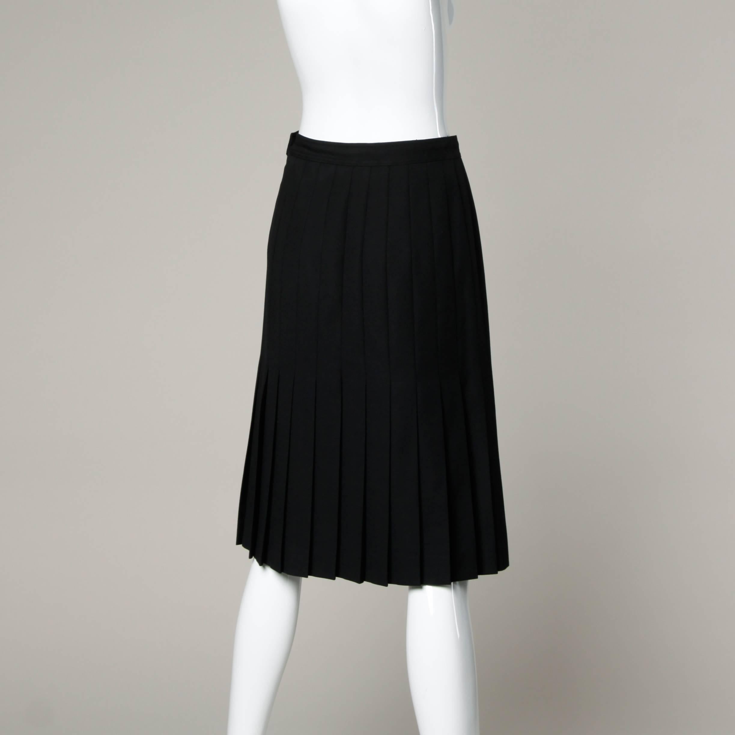 Gorgeous Valentino for Neiman Marcus black wool pleated skirt. Beautiful quality and construction!

Details:

Unlined
Side Zip and Button Closure 
Marked Size: IT 44/ US 10
Estimated Size: Medium
Color: Black 
Fabric: 100% Wool 
Label: