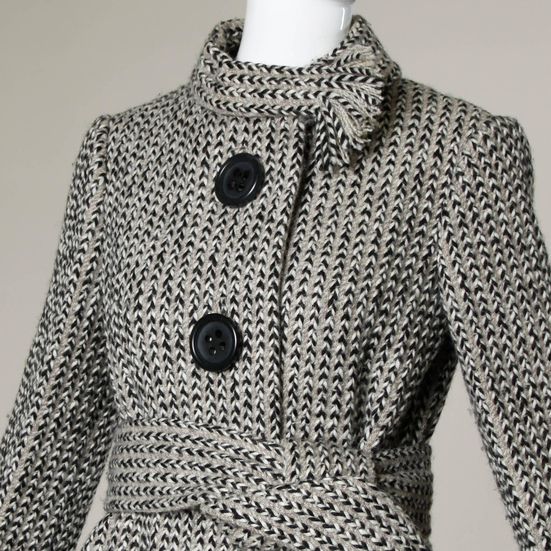 Stunning vintage wool coat by Pauline Trigere with an attached ascot scarf collar and waist tie. Beautiful couture construction with hand-stitched detailing throughout the piece. 

Details:

Fully Lined
Matching Belt 
Front Pockets
Front Button