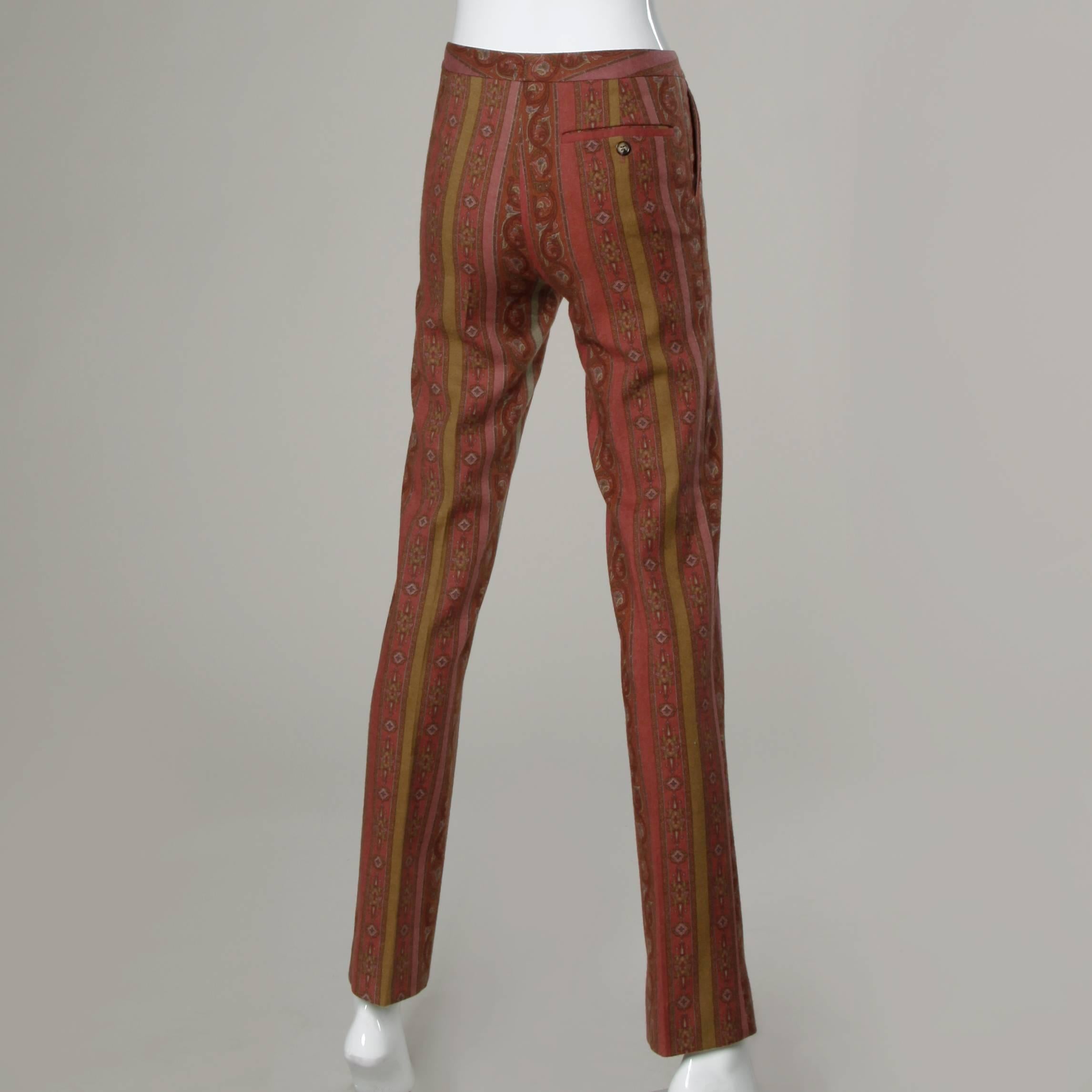 Wool blend paisley pants by Etro.

Details:

Fully Lined
Side Pockets and Back Pocket 
Front Zip and Button Closure
Marked Size: 38
Estimated Size: Small
Color: Maroon/ Rose/ Light Green
Fabric: 92% Wool/ 6% Nylon/ 2% Elastan 
Label: