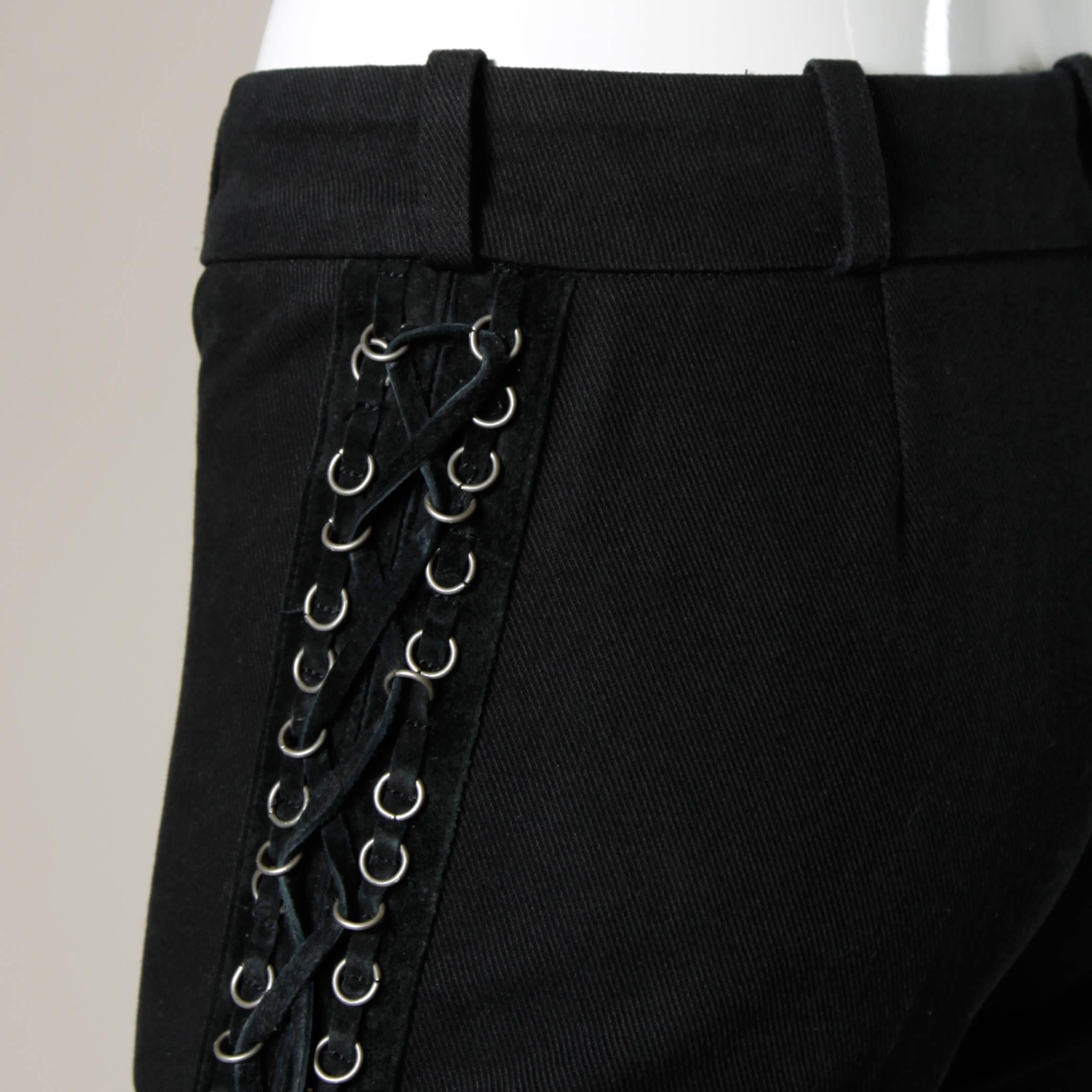 Absolutely incredible black heavy weight denim bell bottom pants with leather lace up detail on the sides of the pants. Ultra flattering flared leg and metal ring detailing. 

Details:

Unlined
Back Pocket
Front Metal Zip and Button 
Marked