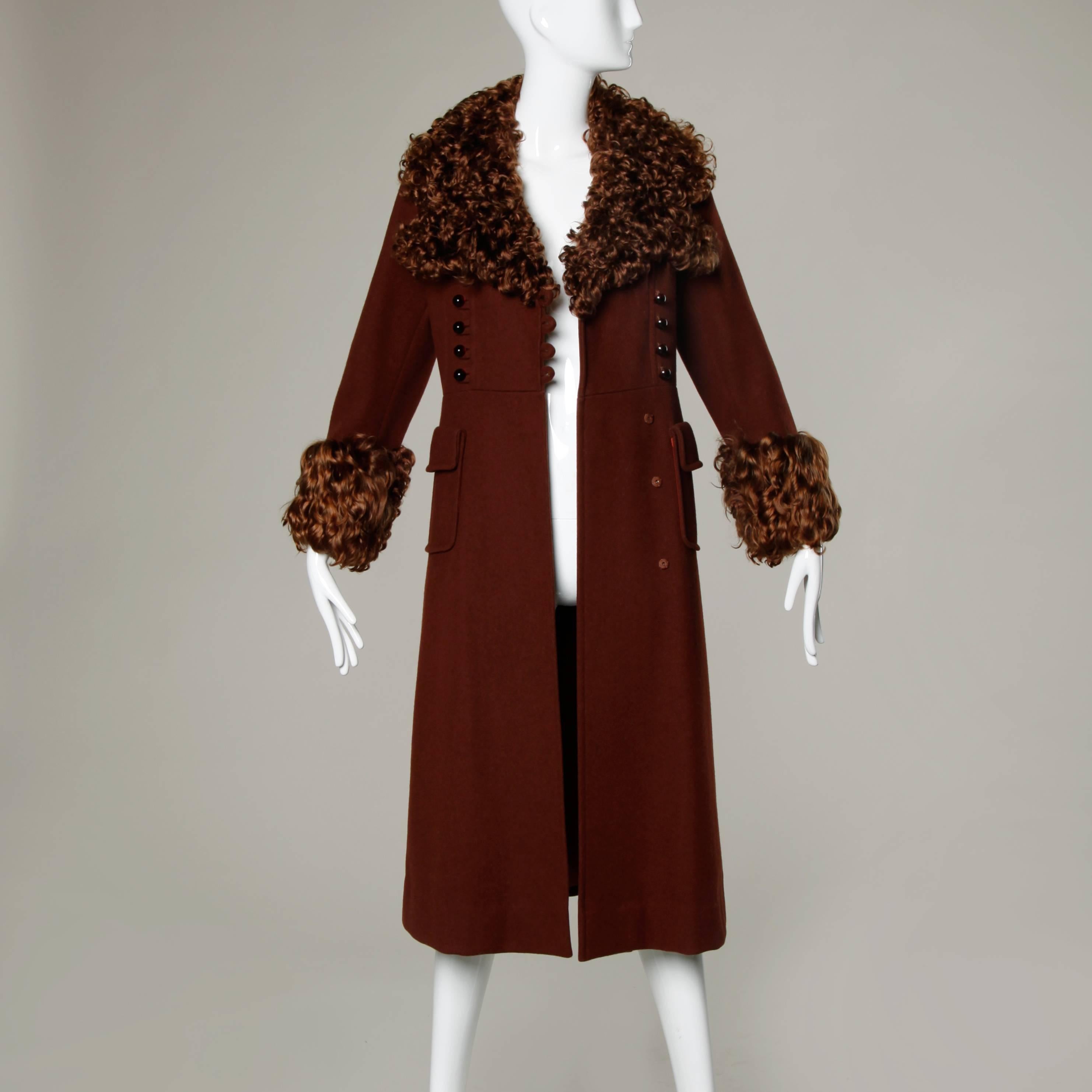 Vintage elegant wool princess coat with military-inspired bobble buttons and genuine Mongolian lamb fur cuffs and collar. 

Details:

Fully Lined
Front Pockets
Front Button and Snap Closure
Marked Size: Not Marked
Estimated Size: