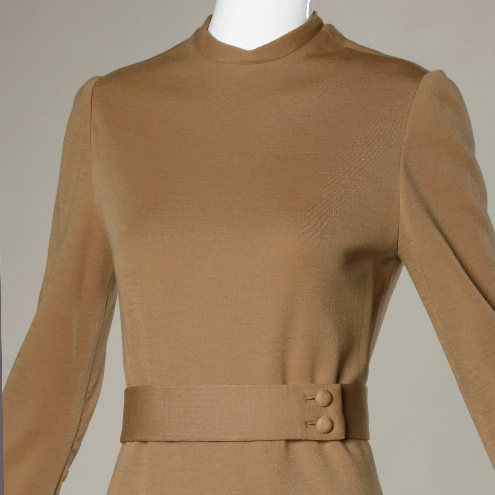 Stunning vintage Norman Norell vintage 1960s camel colored wool knit dress with matching belt. Fully lined in gorgeous quality silk fabric. Hand stitched couture finishing throughout the piece. 

Details:

Fully Lined in Silk
Patch