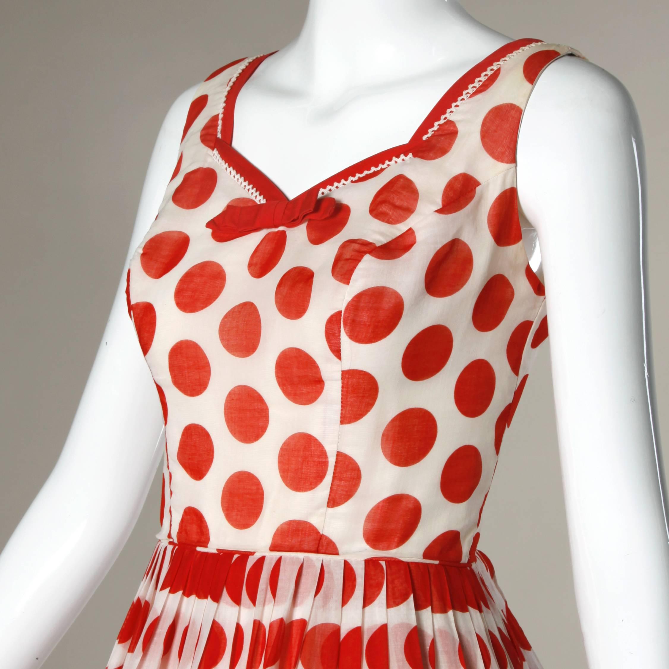 Adorable vintage soft cotton party dress with bright red and white polka dotted fabric and bow trim. Full skirt.

Details:

Fully Lined
Back Metal Zip and Hook Closure
Marked Size: Not Marked
Estimated Size: S-M
Color: Red/ White
Fabric: