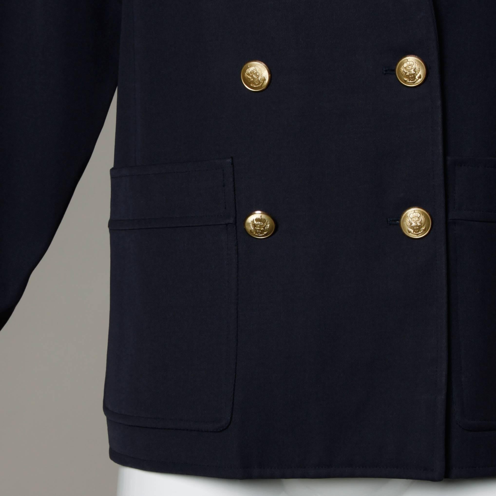 Vintage navy blue military-inspired wool blazer jacket by Saint Laurent Rive Gauche. Oversized boxy fit and gold buttons.

Details:

Fully Lined
Front Pockets
Front Button Closure
Marked Size: IT 34
Color: Navy Blue
Fabric: Not Marked/