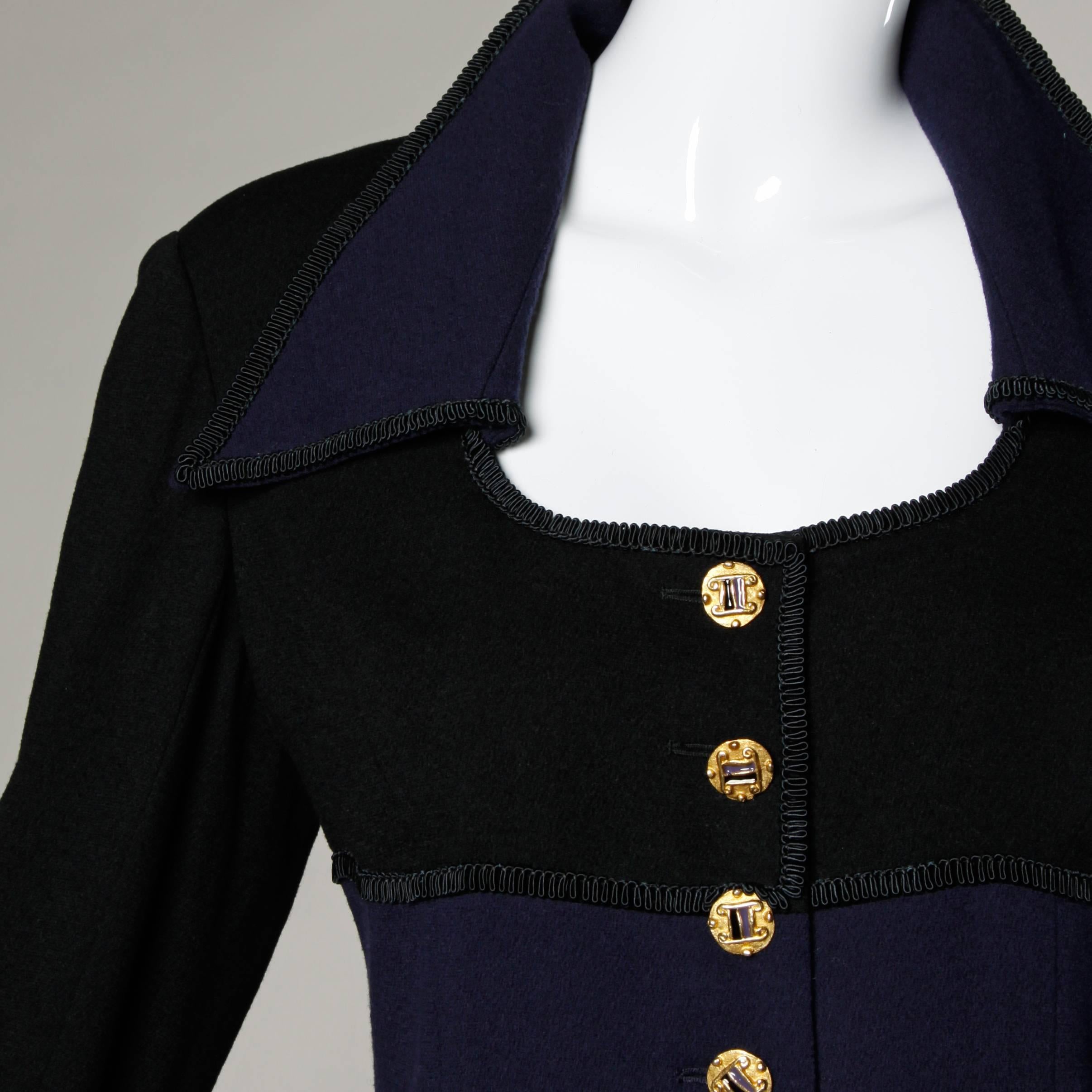 Vintage Louis Feraud coat dress in dark purple and black wool. Unique cut and military-style buttons.

Details:

Fully Lined
Shoulder Pads Are Sewn Into Lining
Front Button and Wrist Button Closure
Marked Size: 12
Estimated Size: