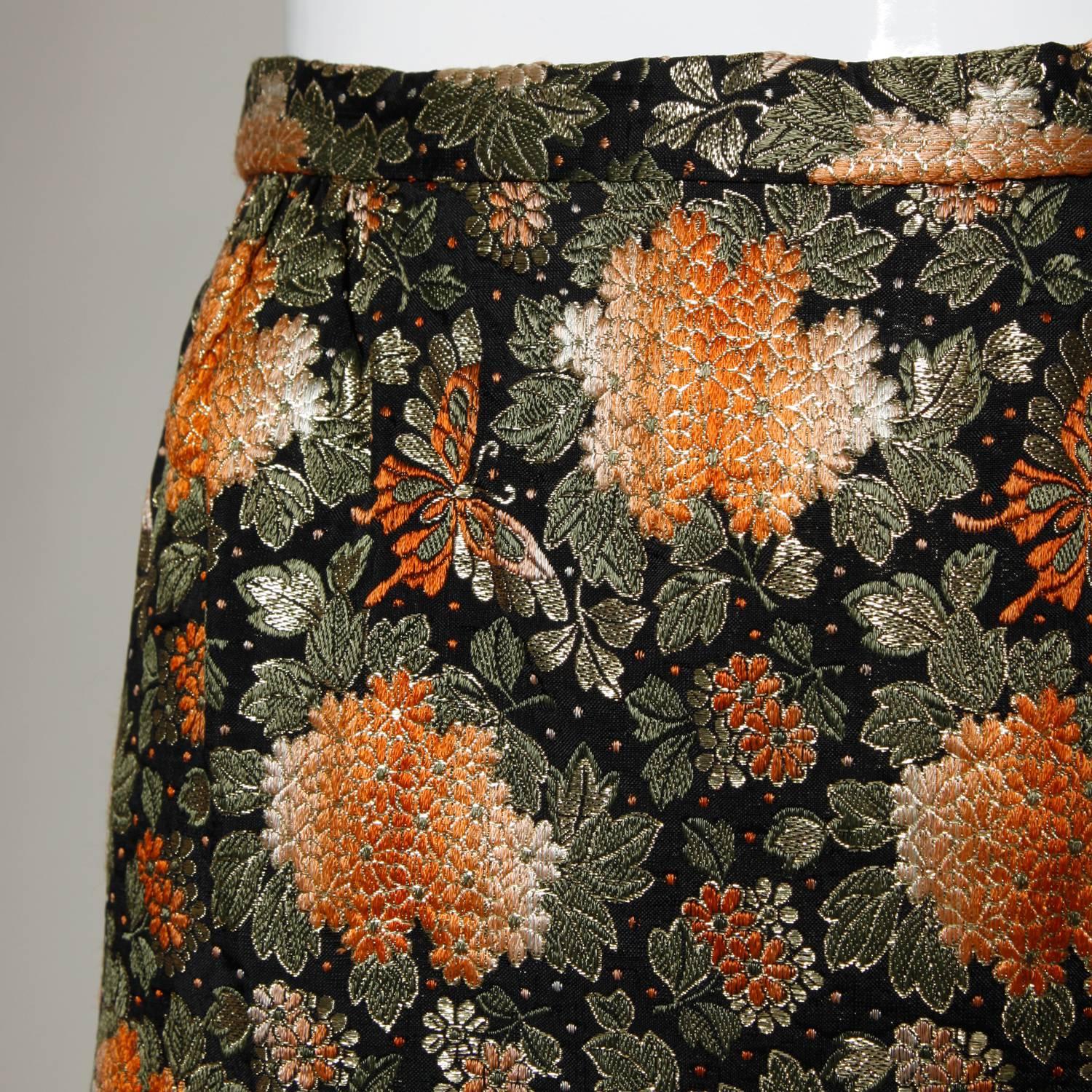 Metallic brocade vintage 1960s maxi skirt with a back slit. 

Details:

Fully Lined
Side Zip and Hook Closure
Marked Size: Not Marked
Estimated Size: S-M
Color: Black/ Gold Metallic/ Orange/ Olive Green/ Light Orange
Fabric: Metallic