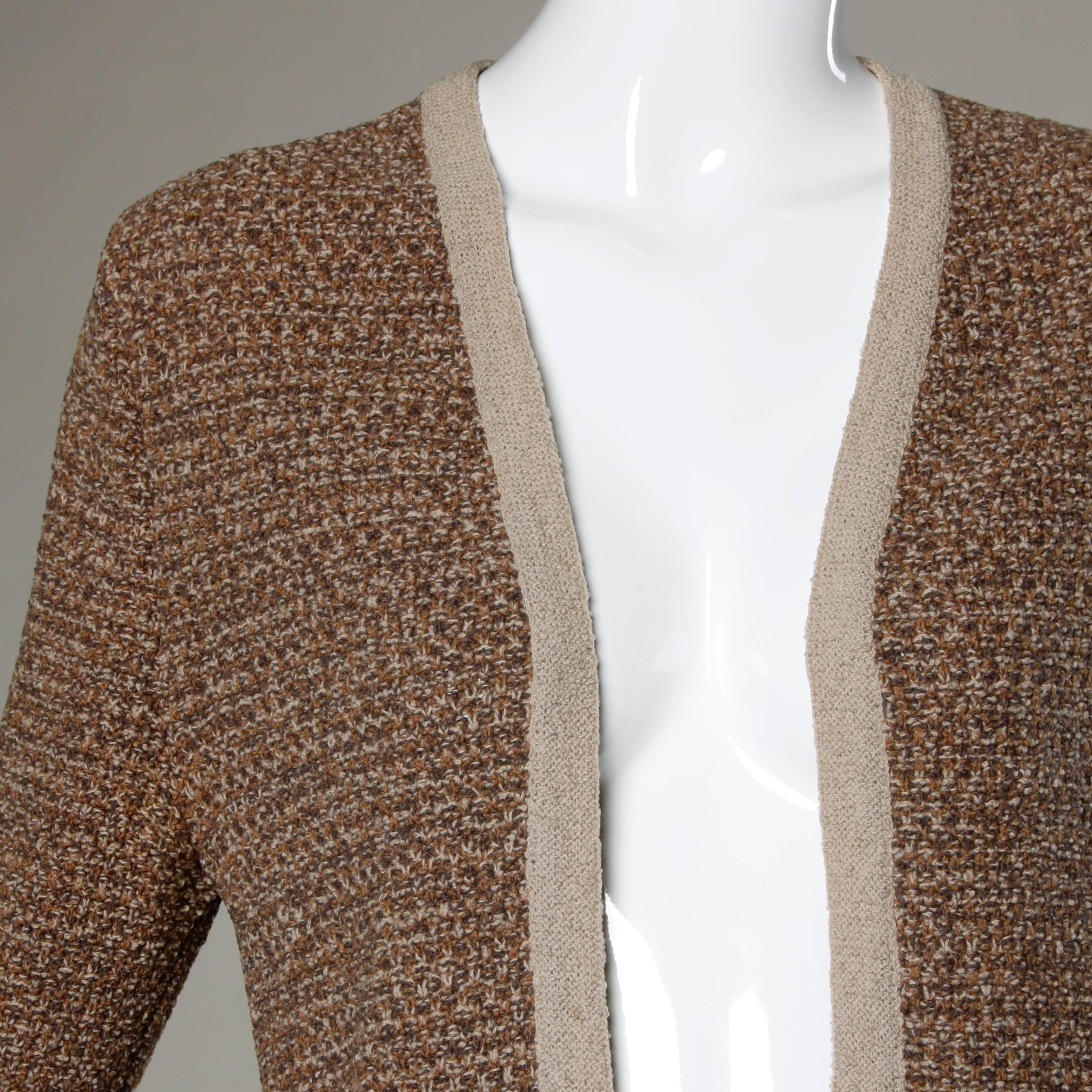 Early Bonnie Cashin vintage knit cardigan sweater.

Details:

Unlined
Front Pockets
No Closure 
Marked Size: Not Marked
Estimated Size: Medium
Color: Tan/ Brown/ Dark Brown
Fabric: Not Marked/ Feels like Wool
Label: Bonnie Cashiu Design/