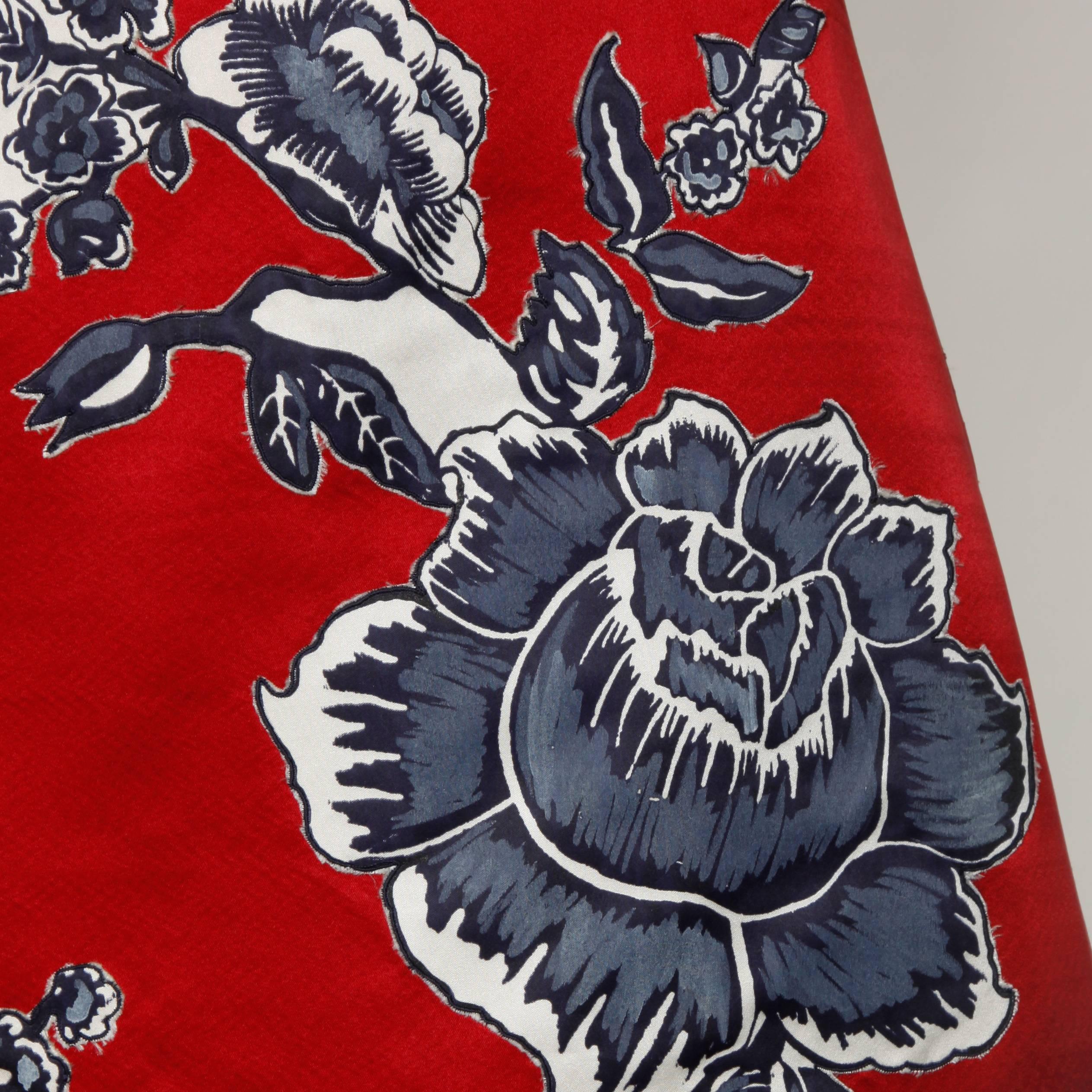 Gorgeous vintage red satin Bill Blass skirt with black, white and gray printed flowers.

Details:

Fully Lined
Side Zip and Hook Closure
Marked Size: Not Marked
Estimated Size: Large
Color: Iridescent Gray Blue, Ivory and Cadmium