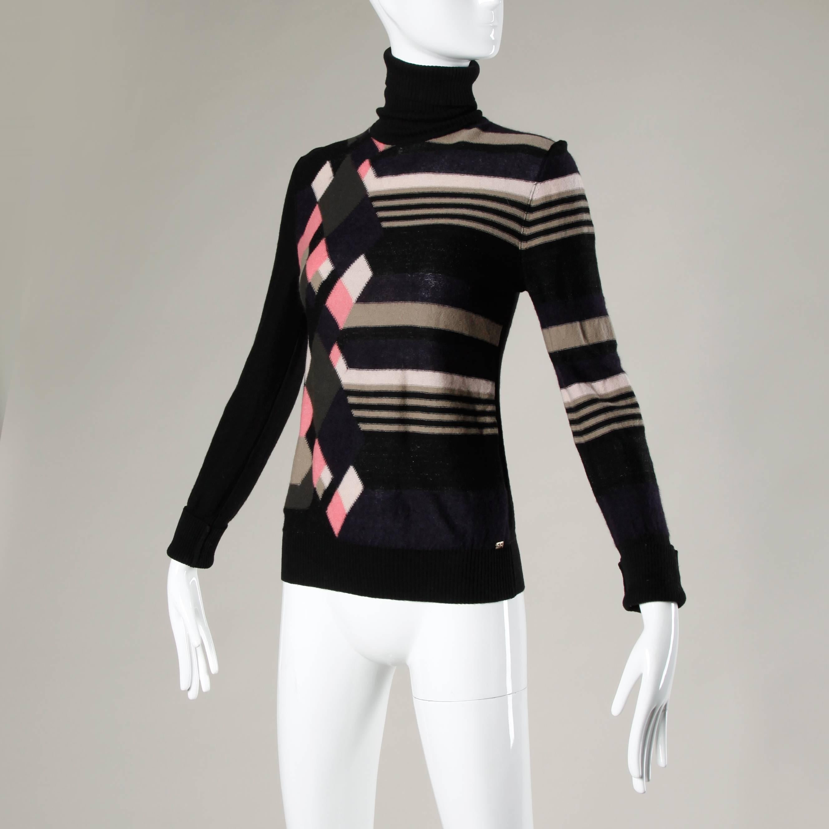 Unlined
No Closure/ Fabric Contains Stretch
Marked Size: 40
Color: Black/ Deep Purple/ Raw Umber/ Beige/ White/ Pink
Fabric: 90% Wool/ 10%Cashmere
Label: Sonia Rykiel

Measurements:

Bust: 34