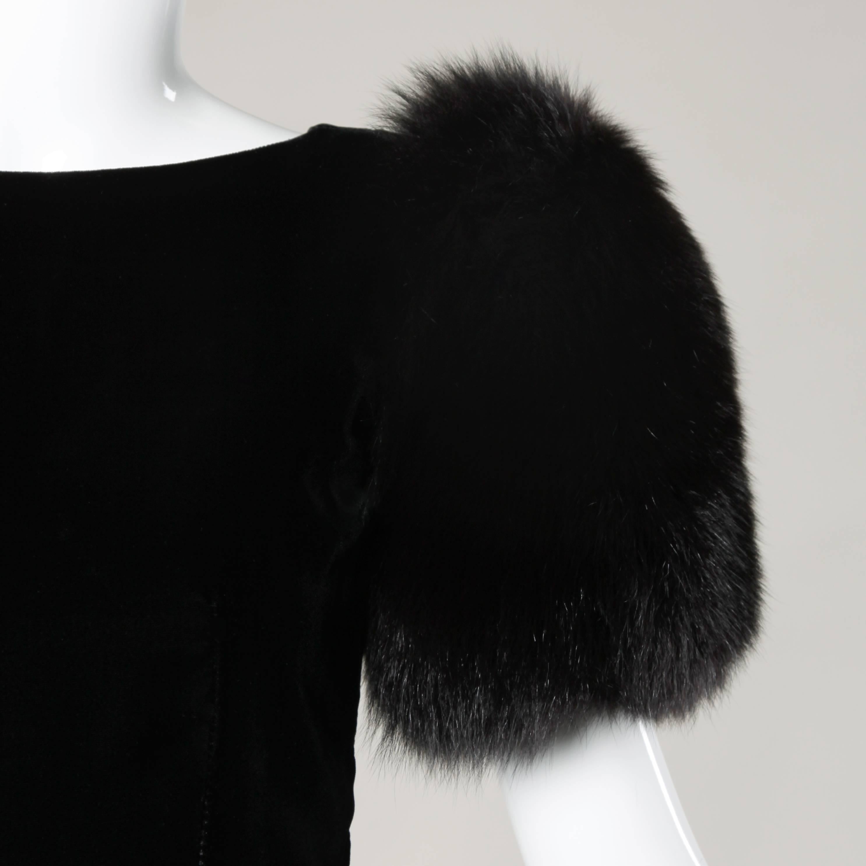 Elegant vintage black velvet sheath dress with giant fox fur sleeves by Victor Costa.

Details:

Fully Lined
Back Zip and Hook Closure
Marked Size: Not Marked
Estimated Size: Small
Color: Black
Fabric: Velvet/ Genuine Fox Fur
Label: Victor