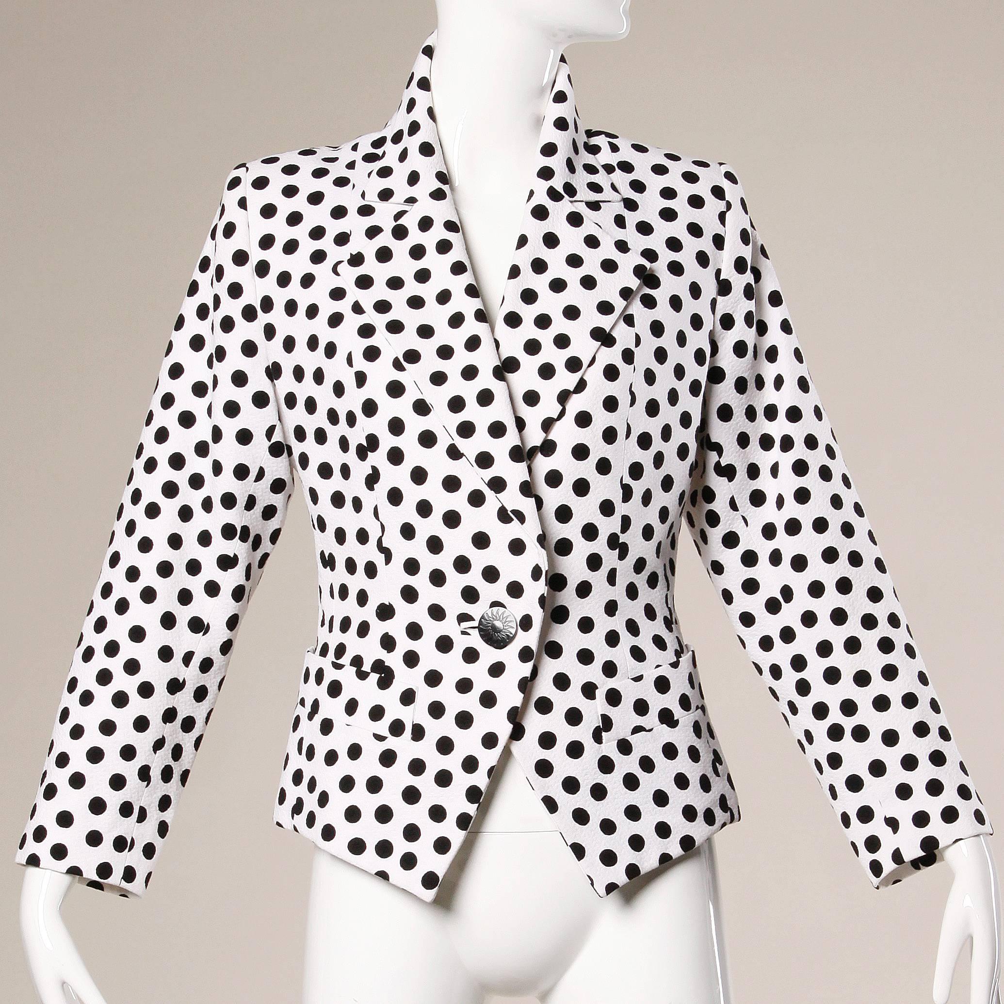 Darling black and white polka dot blazer jacket by Yves Saint Laurent Rive Gauche.

Details:

Fully Lined
Front Pockets
Front Button Closure
Marked Size: F 42
Color: White/ Black
Fabric: 100% Cotton
Label: Yves Saint Laurent