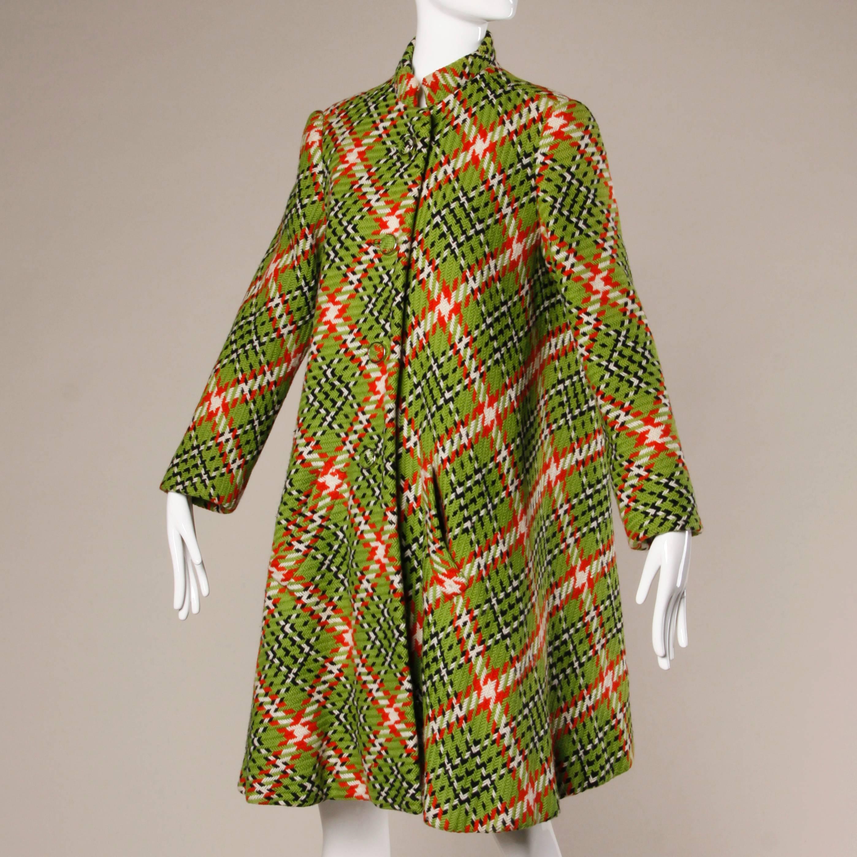 Amazing 1960s vibrant green and red woven plaid swing coat by Donald Brooks. Incredible hand stitched couture detailing and swing shape. Very thick, heavy and warm. A beautiful piece!

Details:

Fully Lined
Front Pockets
Front Button