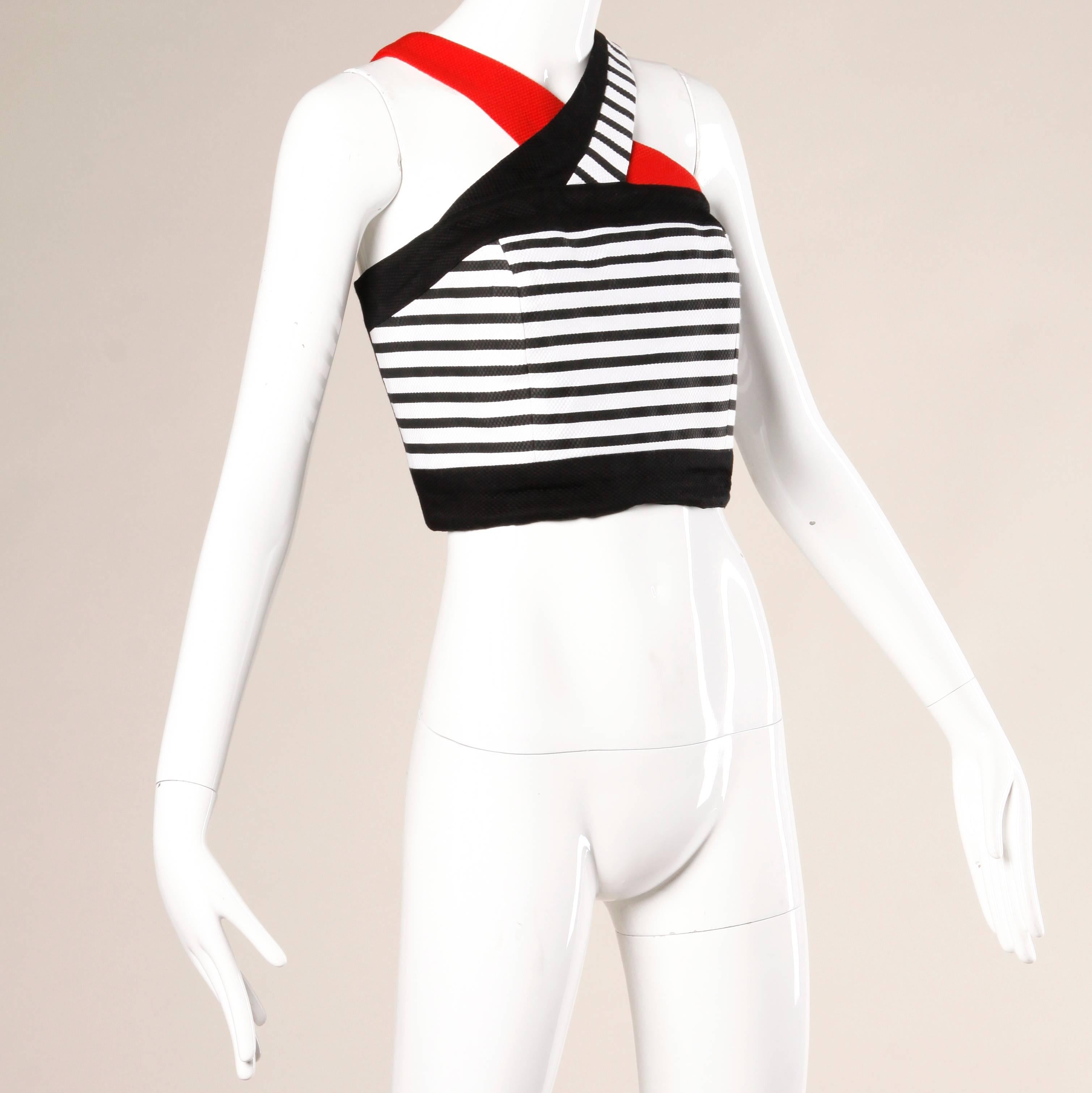 Vintage 80s/90s well constructed striped crop top in red, white and black by Lillie Rubin.

Details:

Fully Lined
Back Button Closure
Marked Size: US 10
Estimated Size: 10
Color: Black/ White/ Red
Fabric: Not Marked/ Feels like