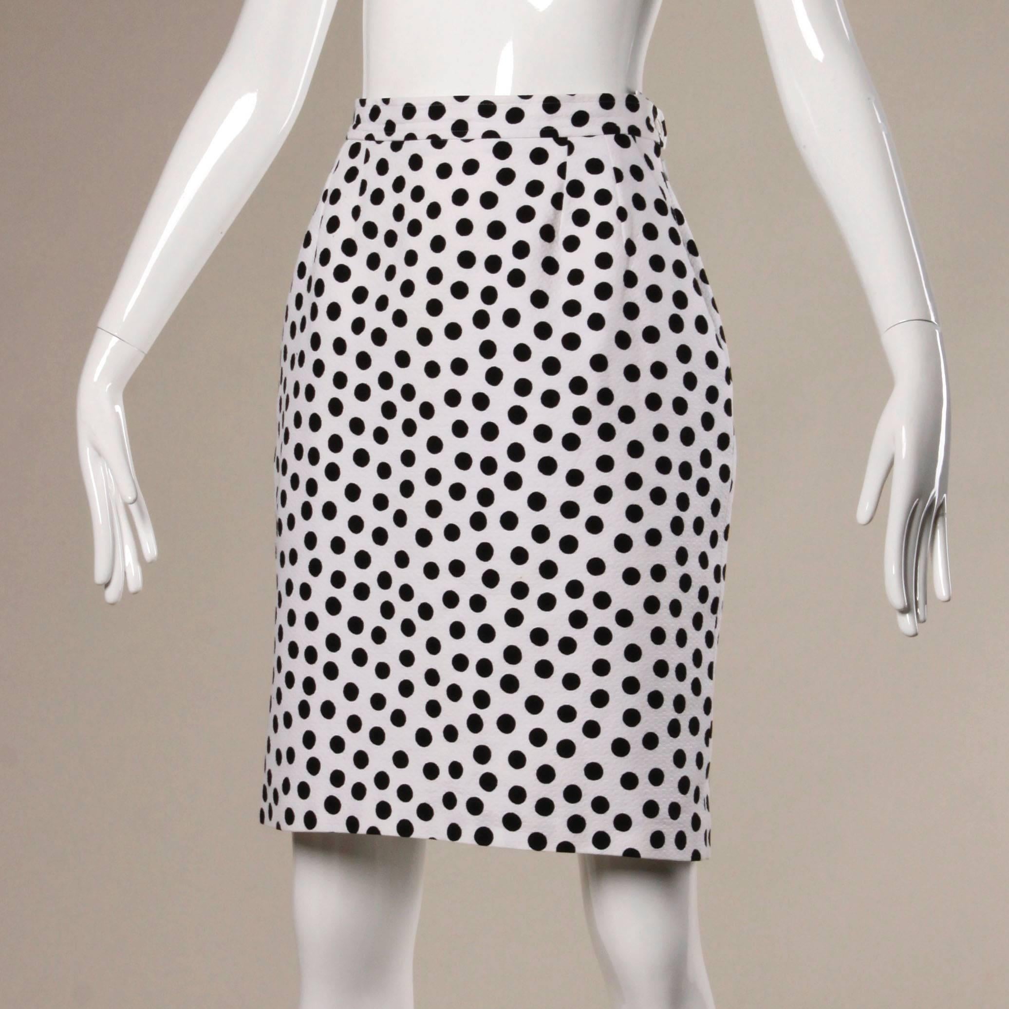 Darling black and white vintage polka dot skirt by Yves Saint Laurent Rive Gauche.

Details:

Fully Lined
Side Pockets
Side Zip and Button Closure 
Marked Size: F 42
Estimated Size: Medium
Color: Black/ White
Fabric: 100% Cotton
Label: