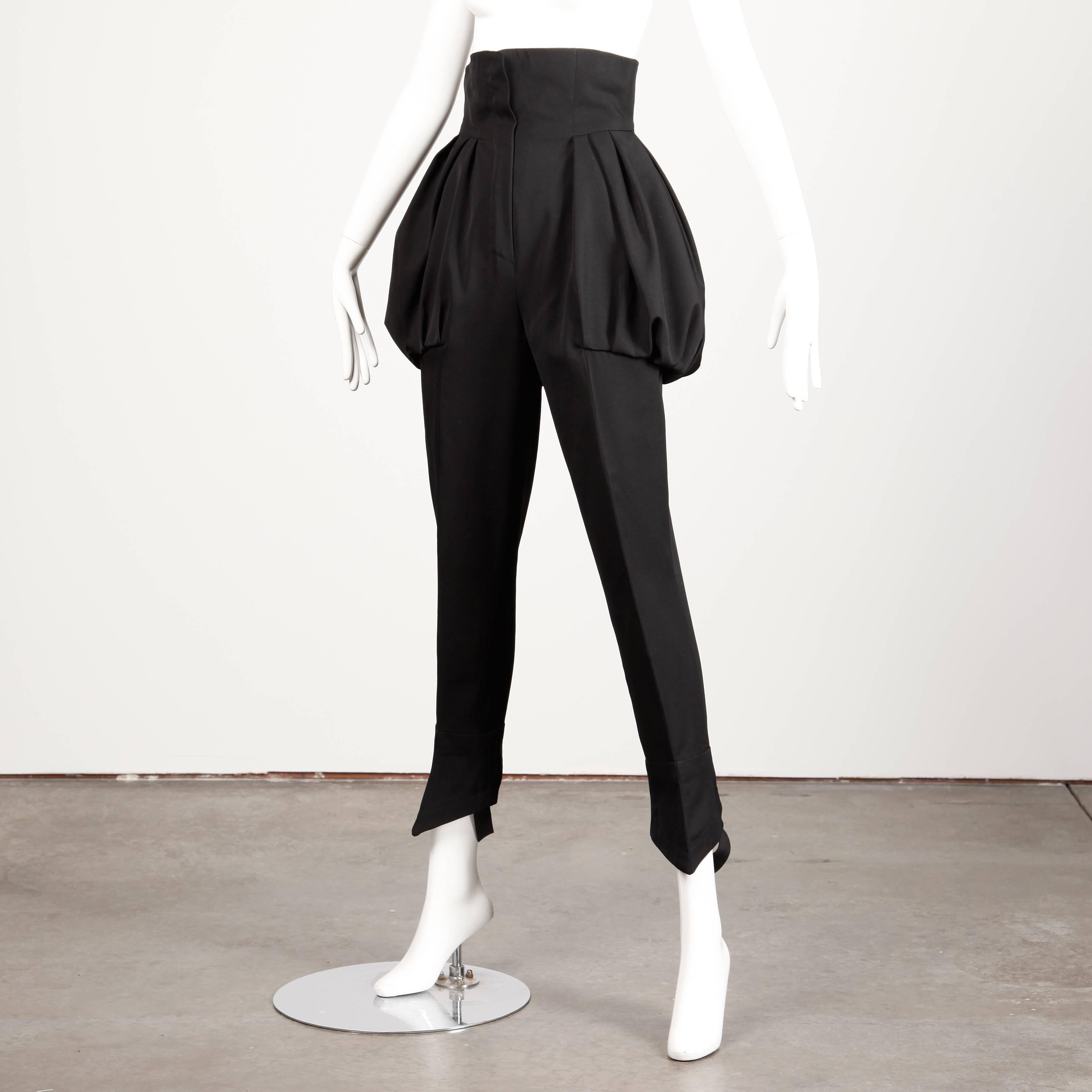 Extremely rare vintage 1980s black wool stirrup pants by Bernard Perris. Extraordinary avant garde shape with a high waist and voluminous paper bag pockets. Stirrups are elastic and hook closed. 

Details: 

Partially Lined
Side Pockets
Front