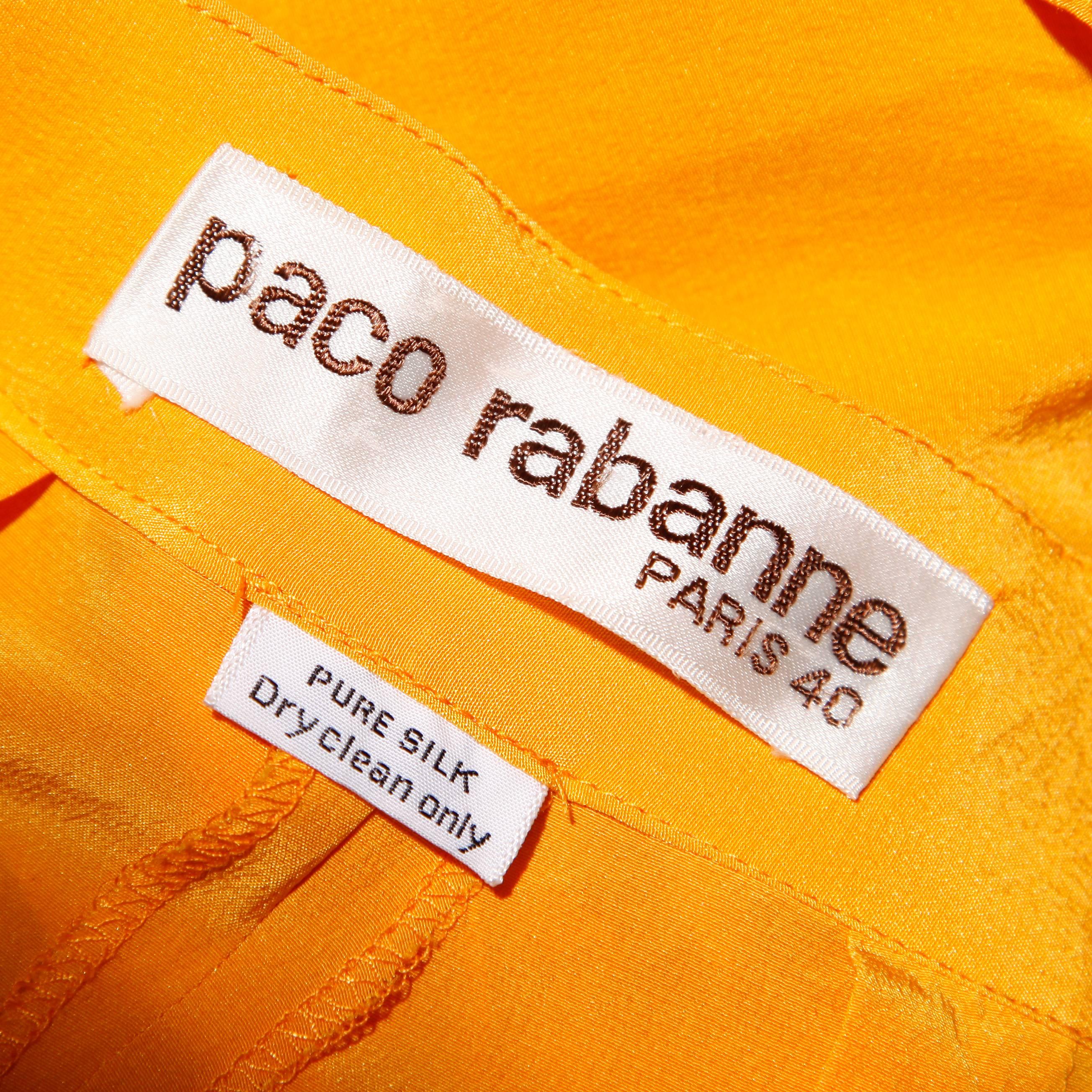 Chic 1980s ruffled deep tangerine-yellow cropped pants by Paco Rabanne. Tapered hemline hits right below the knee. Voluminous shape with ruffled detail.

Details: 

Unlined
Front Pockets
Front Zip with Button
Marked Size: EU 40
Estimated