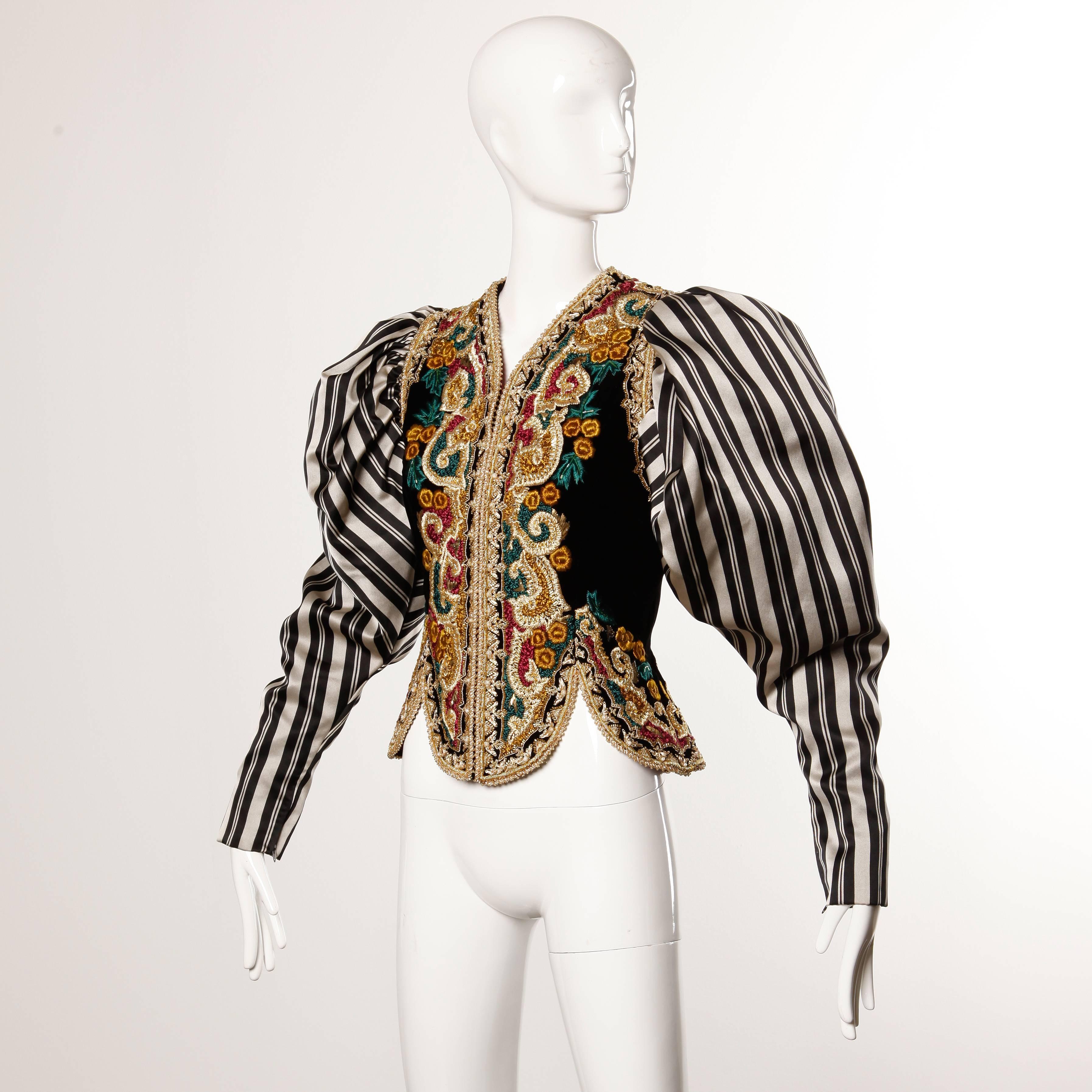Incredible vintage 1980s embroidered jacket with massive striped silk satin sleeves by Oscar de la Renta. Meticulous hand embroidered Baroque-inspired design with tiny pearl beads. The jacket zips up the front and is fully lined in heavy silk satin.