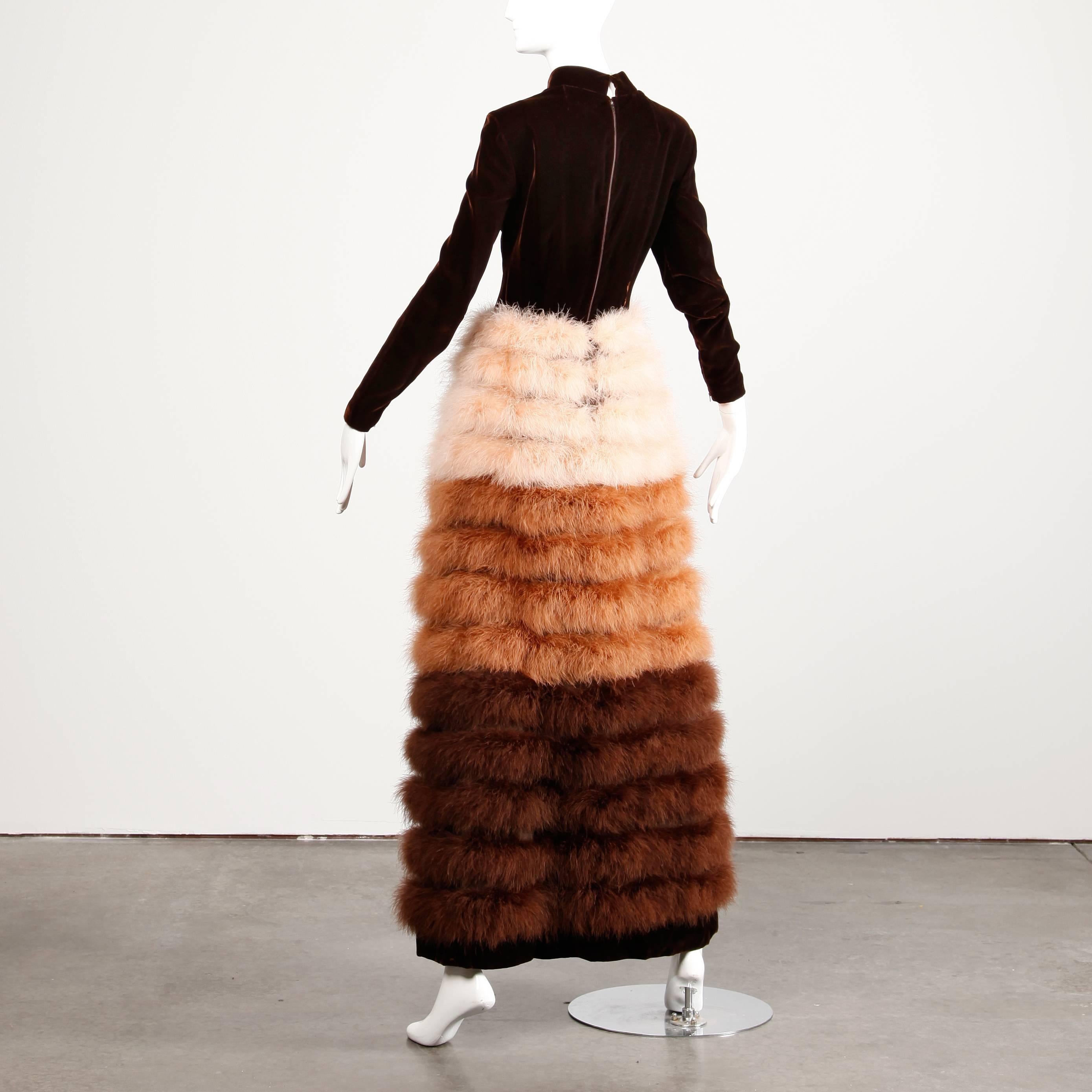 Museum-quality iconic vintage 1960s brown velvet gown with brown, tan and pink marabou feathers by Geoffrey Beene. Long sleeves with zip detail at the wrists and huge voluminous feather skirt. 

This dress is missing the label but it is a well