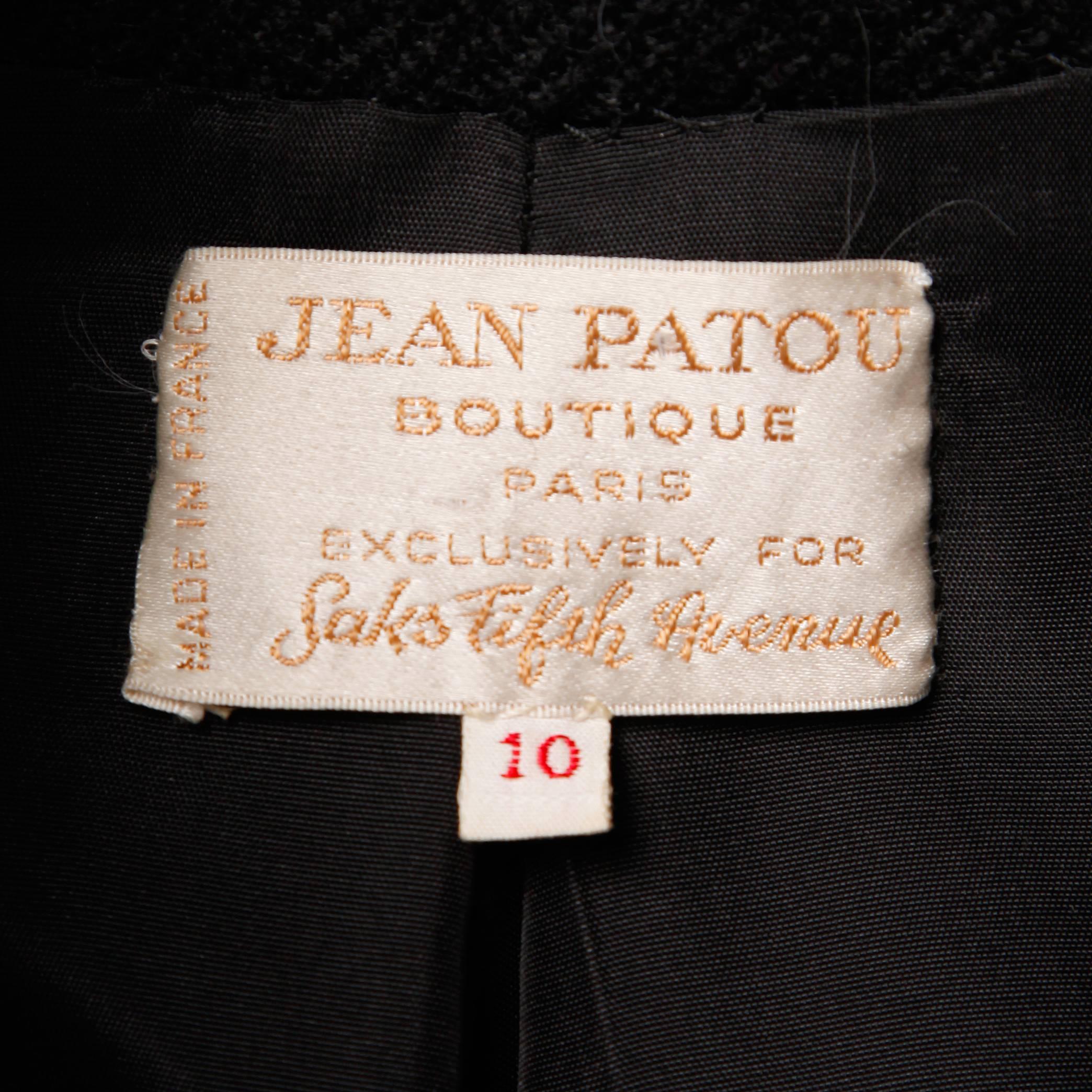 Gorgeous vintage black wool coat by Jean Patou! Extraordinary construction with notched lapels and pop up collar. Heavy weight wool.

Details: 

Fully Lined
Side Slit Pockets
Button Front Closure
Marked Size: 10
Estimated Size: