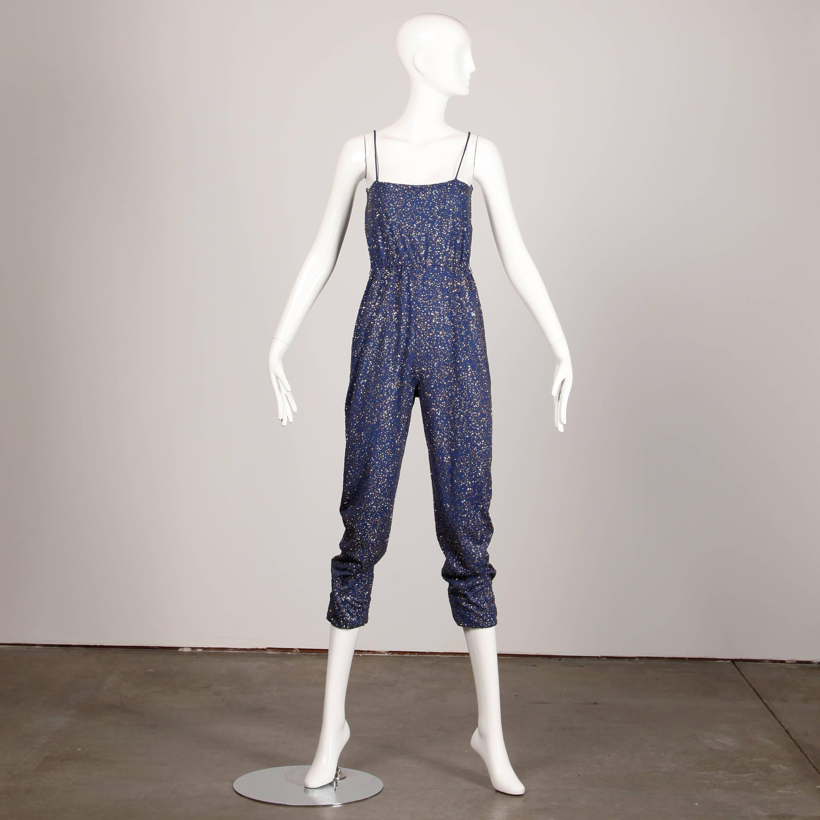 Fantastic vintage blue jersey knit jumpsuit by Pat Richards with allover sparkly glitter sequins. Cropped leg and spaghetti straps. Belt loops but no belt included.

Details: 

Unlined
Marked Size: 8
Estimated Size: Small
Color: Blue/